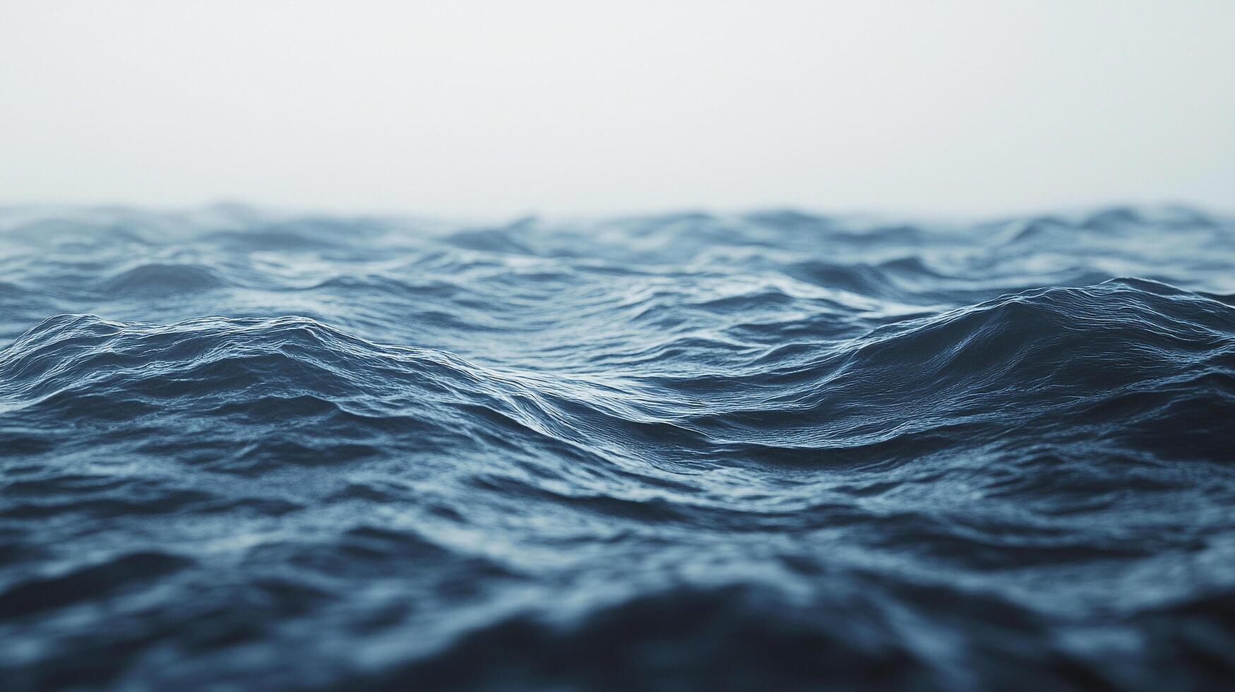 Tranquil sea with gentle waves under a foggy sky, evoking serenity and calmness. Ideal for backgrounds or contemplative visuals. photo