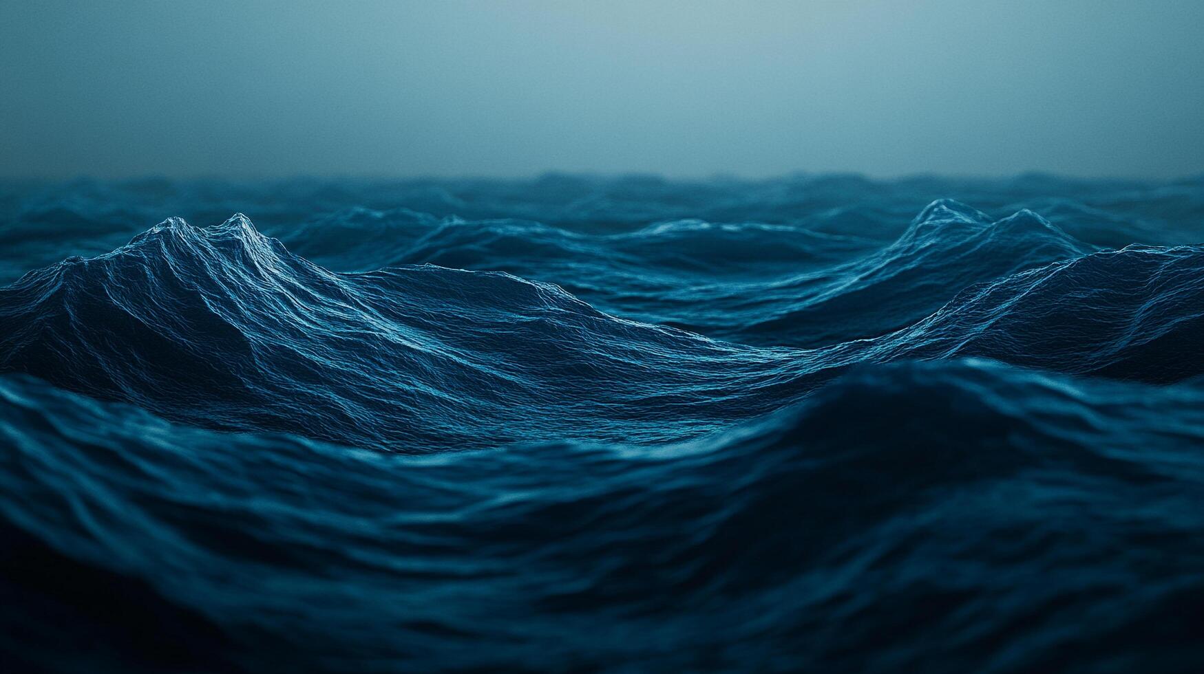 A captivating view of the ocean's surface with gentle, rolling waves. The deep blue hues of the water create a serene and calming atmosphere. photo