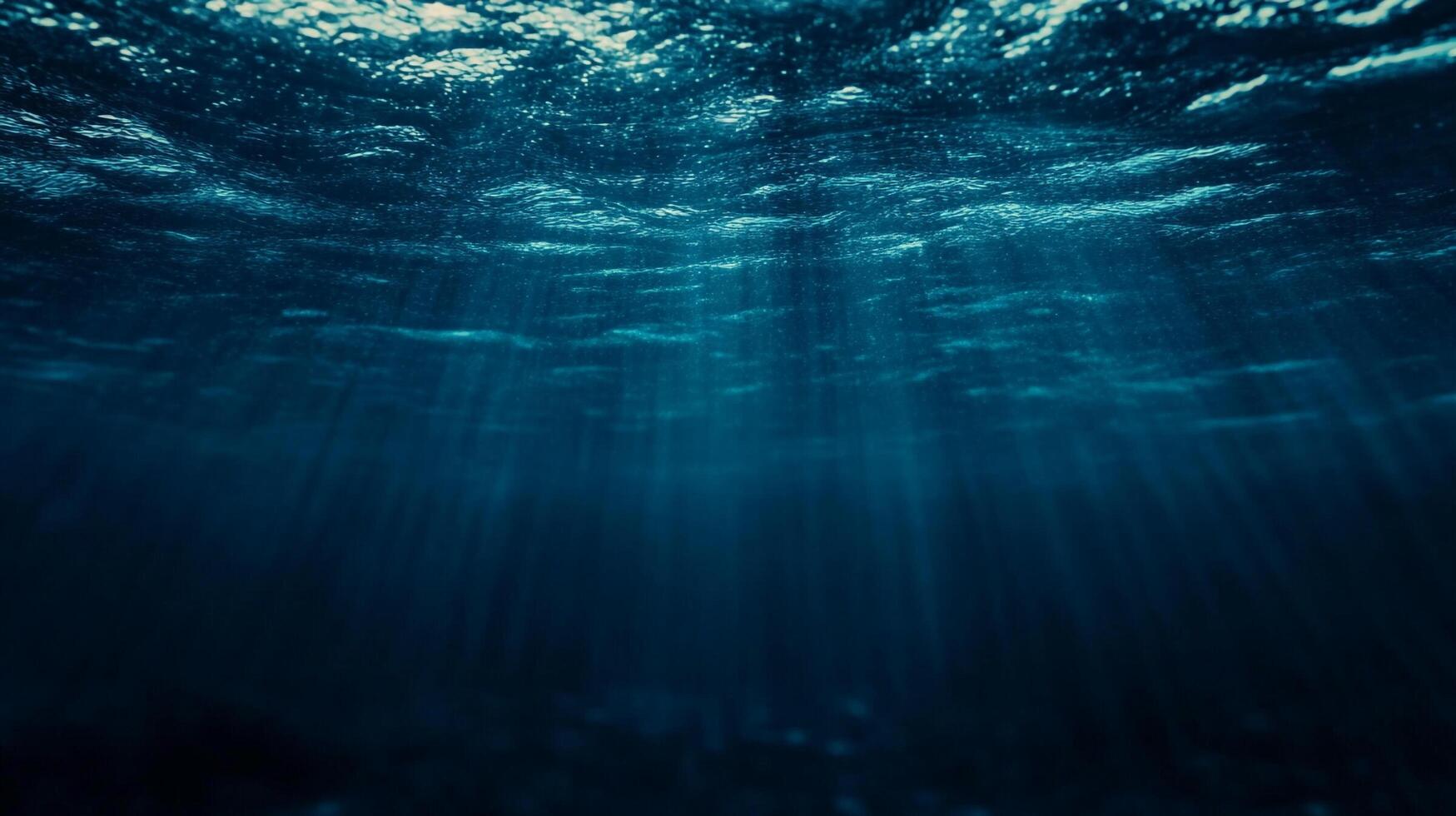 Sunlight streams into the serene ocean depths, creating a mesmerizing underwater scene of calm and ethereal beauty, inviting exploration. photo
