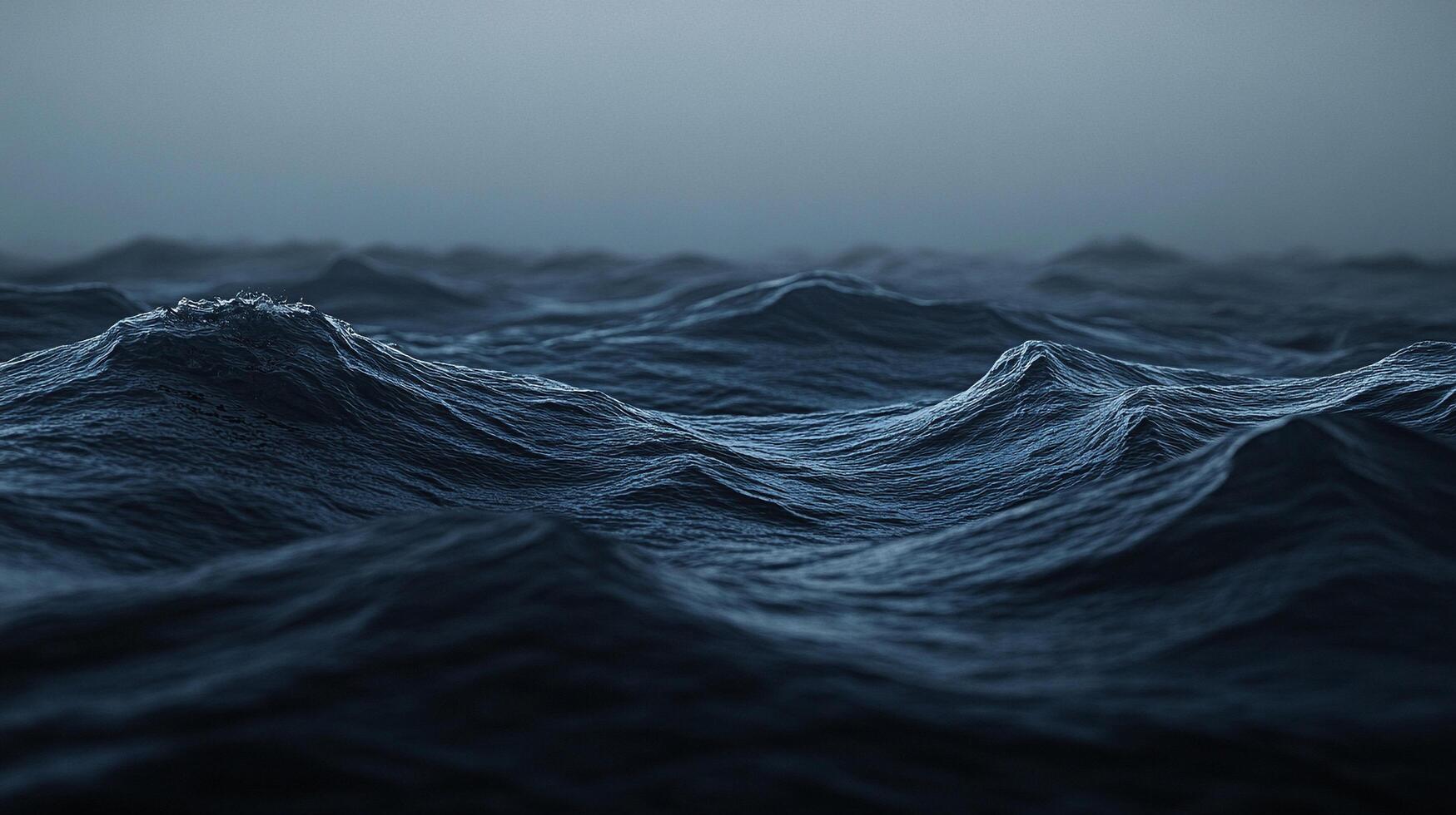 Moody ocean view with turbulent, dark blue waves rolling under a gray sky. Nature's power is on full display in this striking seascape. photo