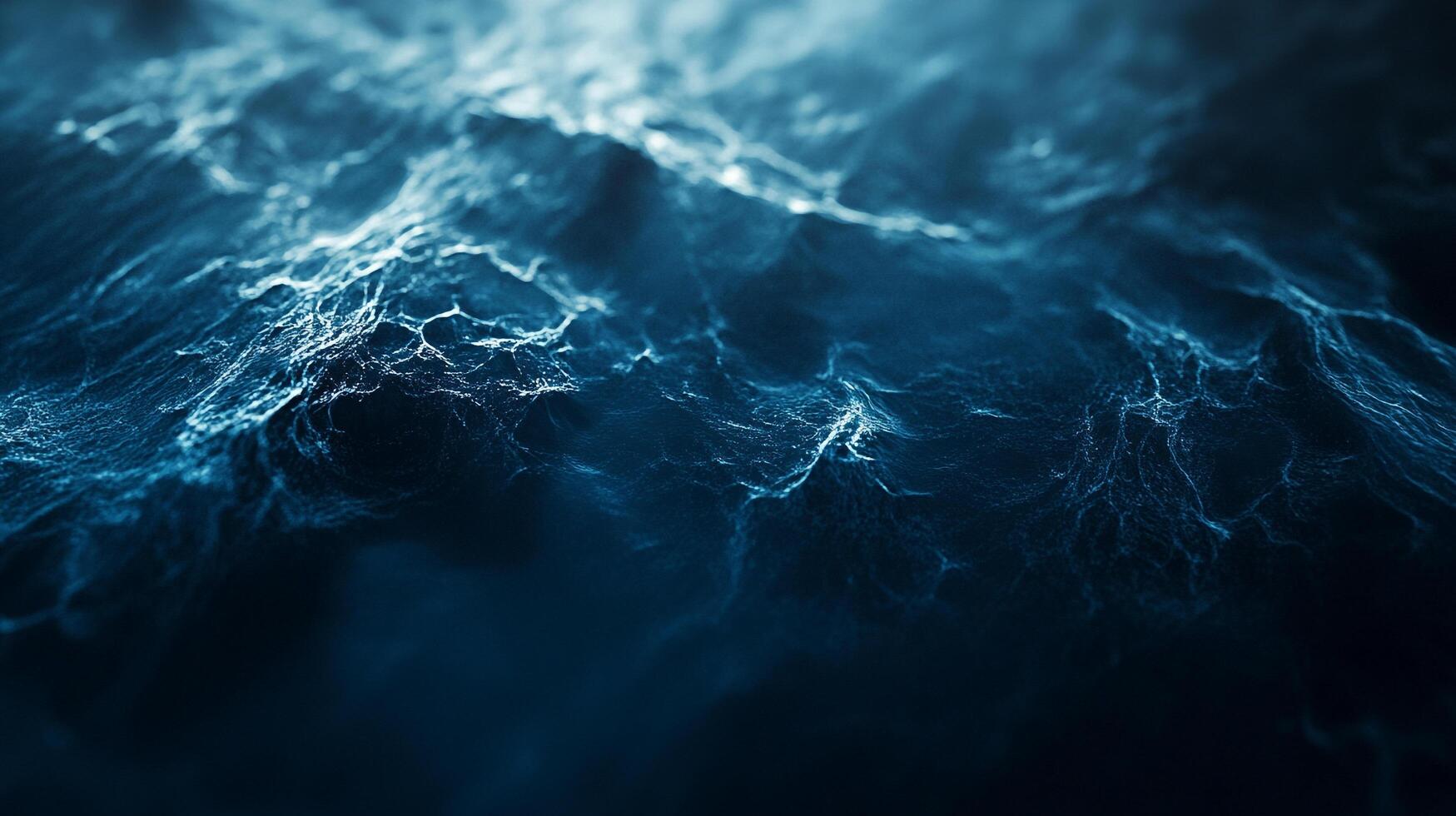A mesmerizing close-up of ocean waves in varying shades of blue, capturing the dynamic energy and natural beauty of water movement. photo