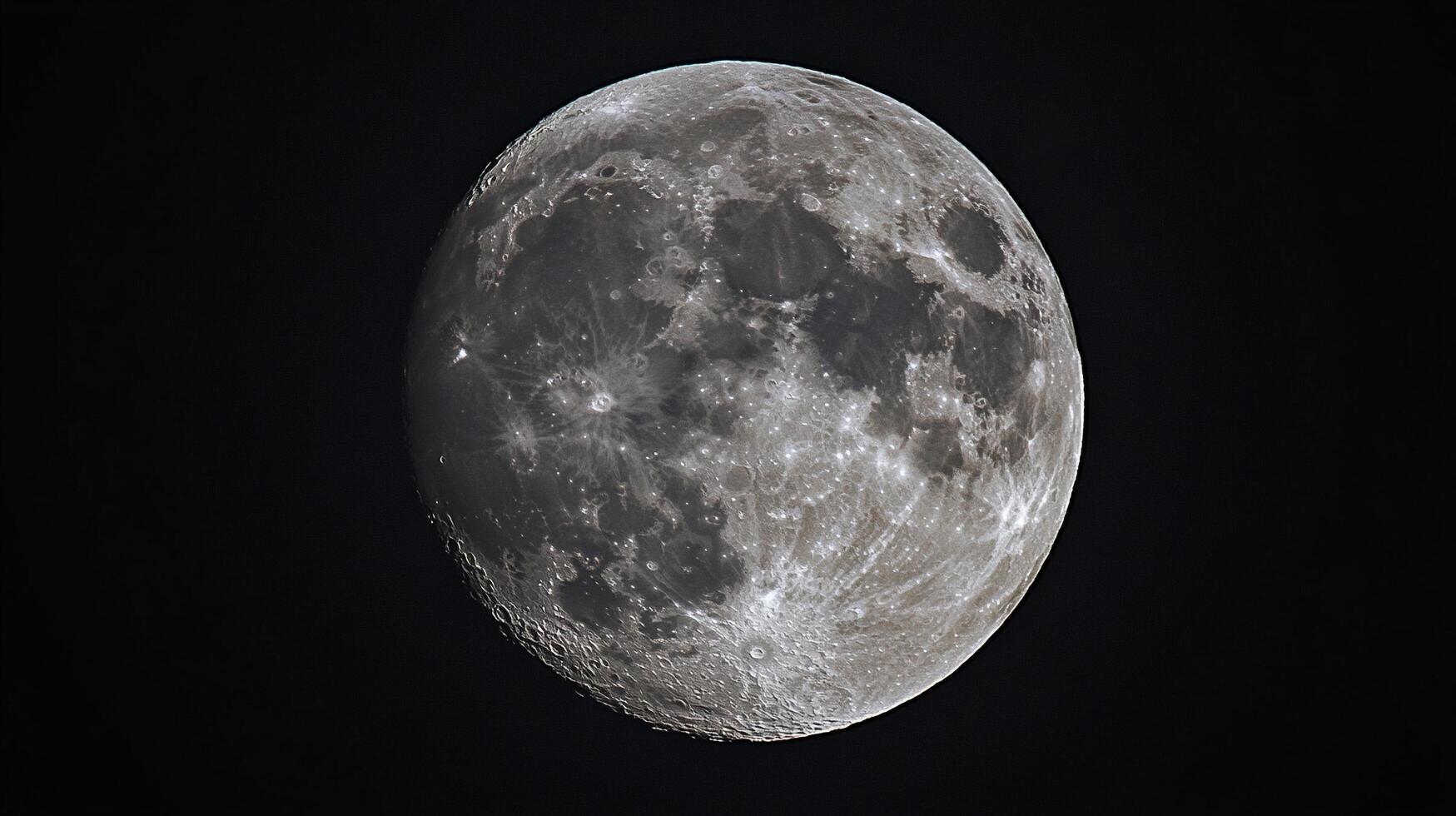 Detailed lunar surface reveals craters and textures against dark backdrop. A celestial view of Earth's only natural satellite. photo