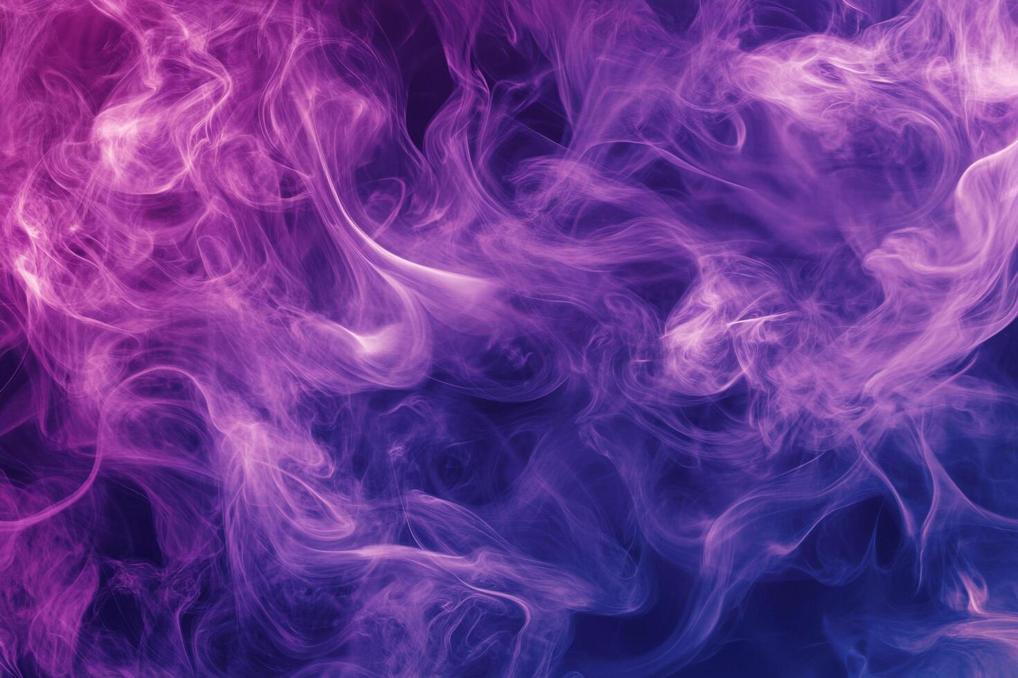 Swirls of purple and pink color the ethereal smoke, creating a mesmerizing and dreamlike pattern of movement and light. photo