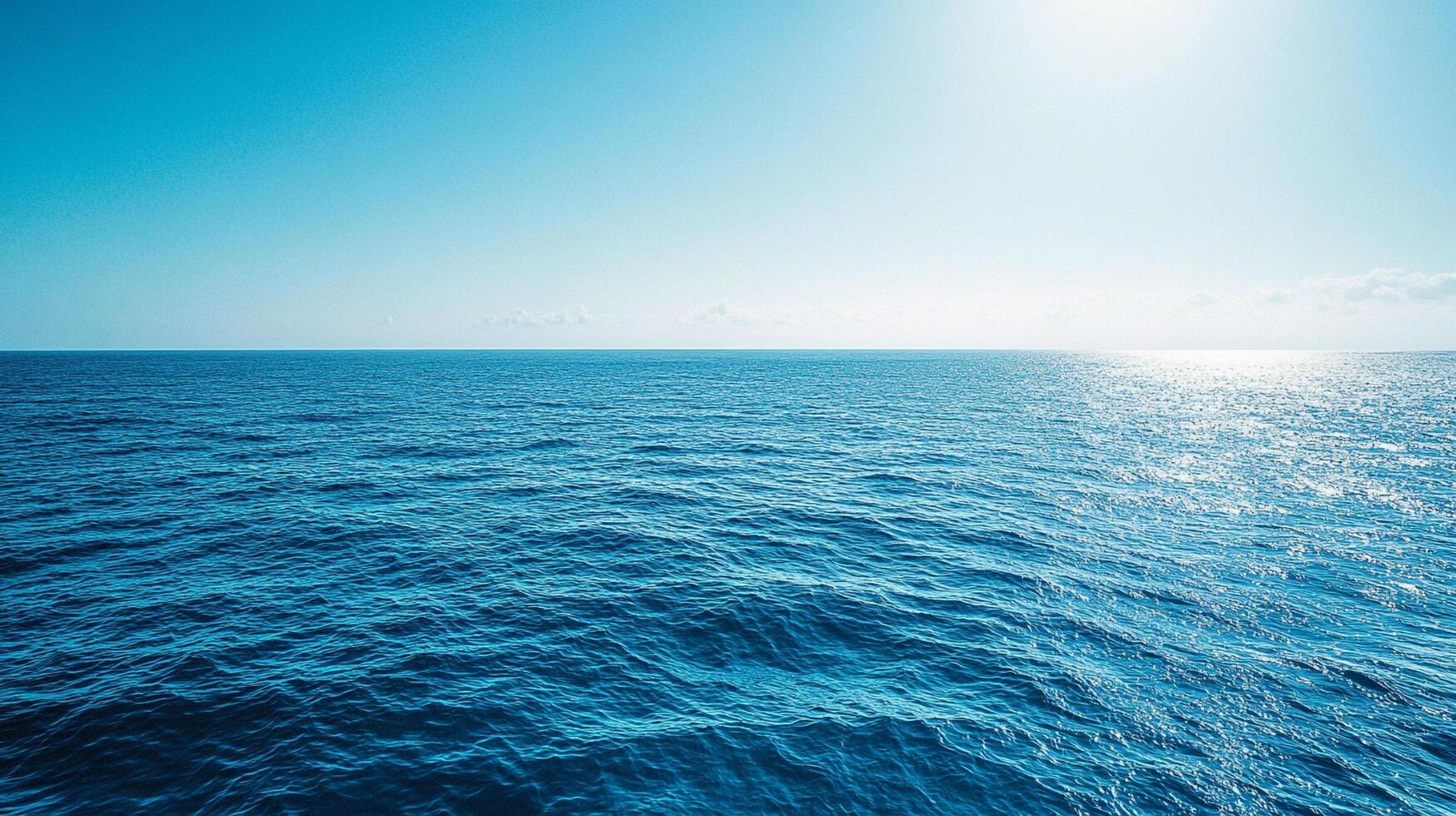 Blue seascape. A serene and calm ocean scene. Clear skies meet rippling waters, creating a tranquil, open horizon for a peaceful view. photo