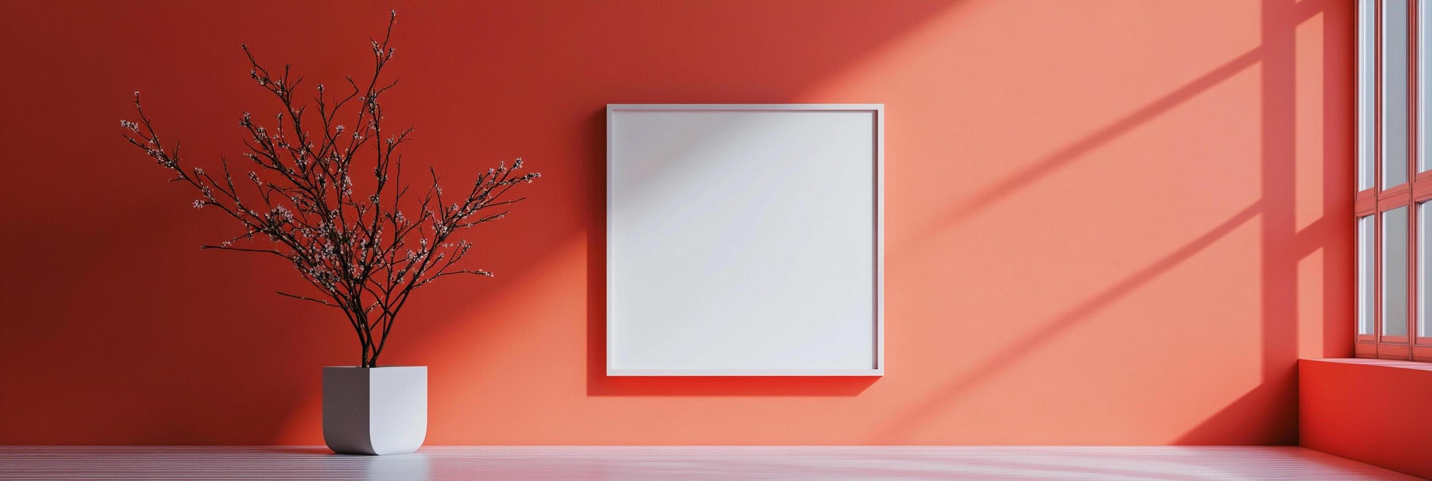 Minimalist room featuring a blank square frame, a potted plant, a light orange wall, and window light patterns on the adjacent wall. photo