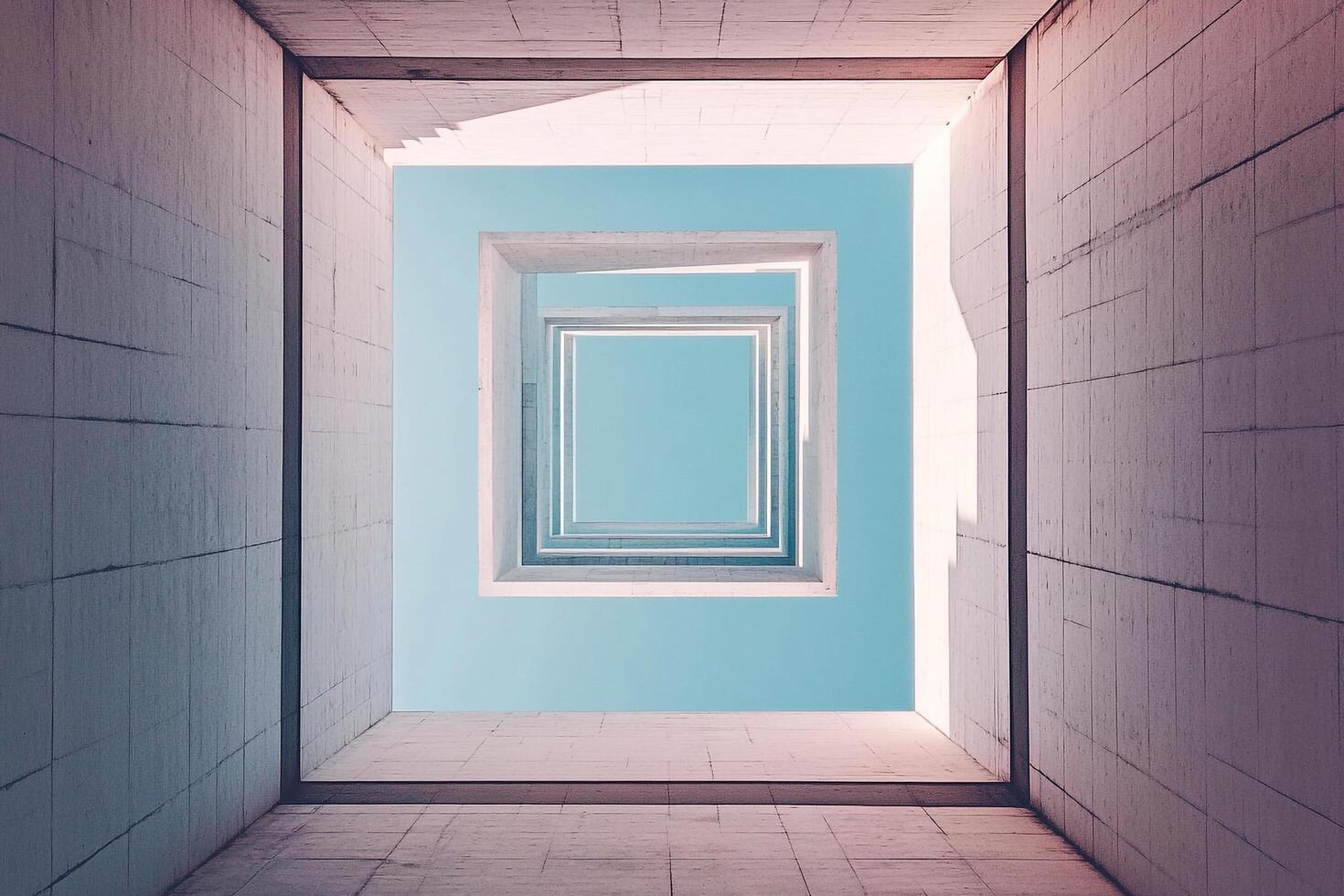 A striking architectural image of nested square structures reaching towards a tranquil blue sky, showcasing geometric patterns and depth. photo