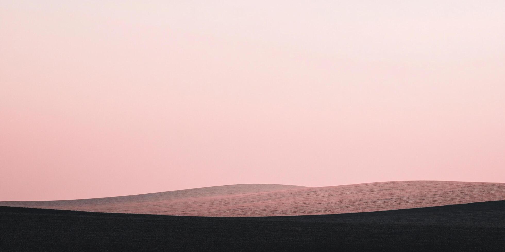 Minimalist landscape with soft pink sky over rolling fields, showcasing a serene and abstract composition of color and form. photo
