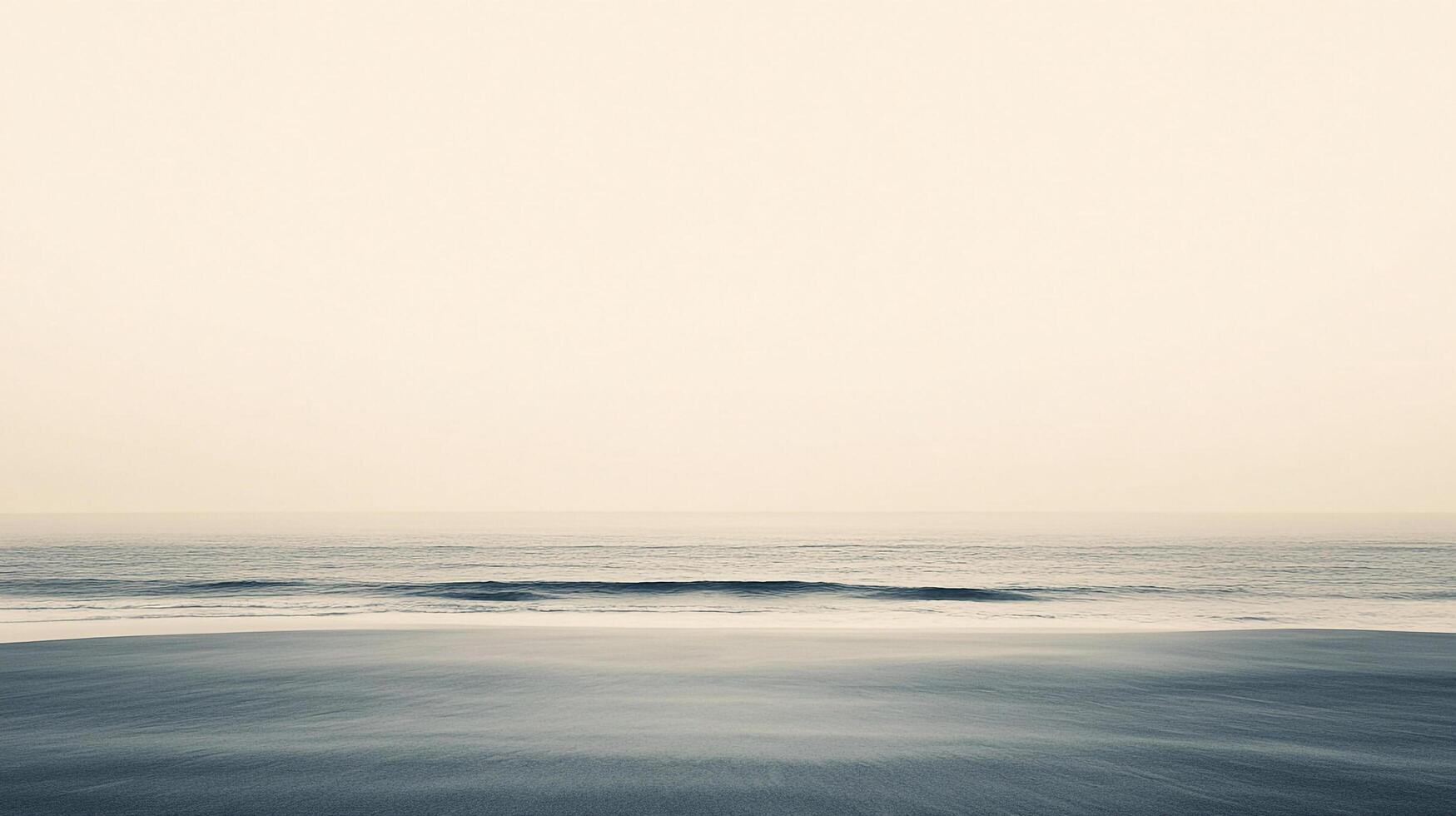 Calm seascape with gentle waves. The sand blends into the water under a soft, serene sky, creating a peaceful, minimalist vista. photo