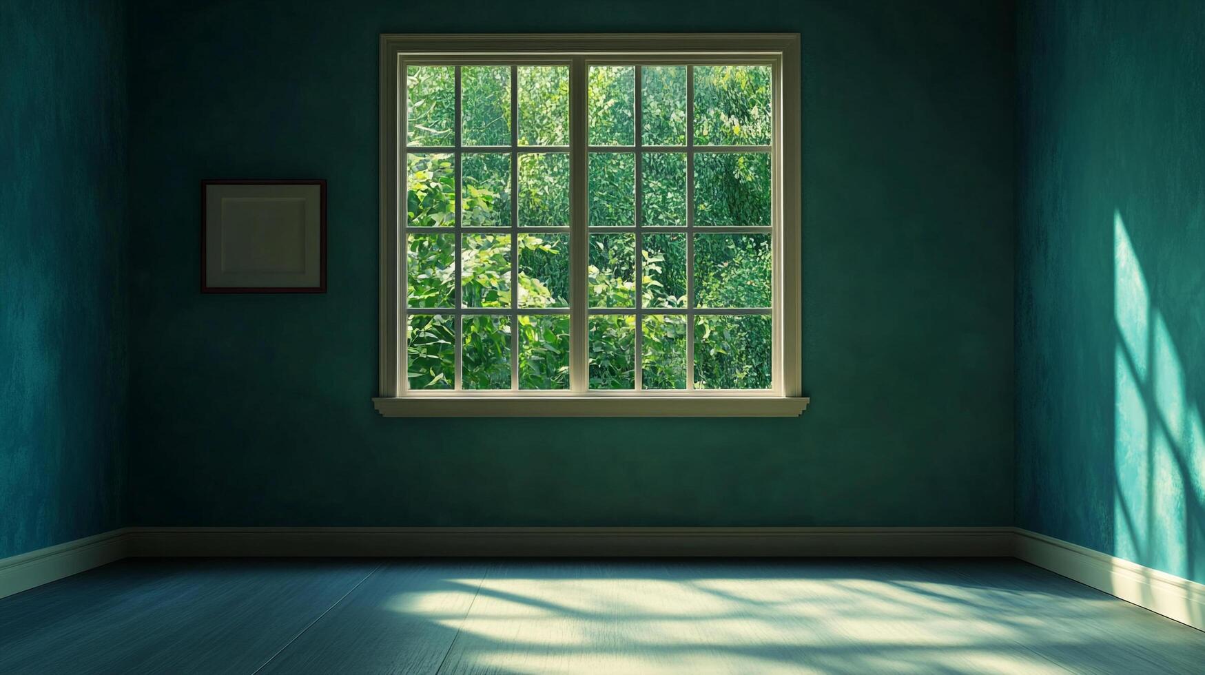 An empty, teal room with a window looking out at bright green foliage, with sunlight streaming in to illuminate the bare floor. photo