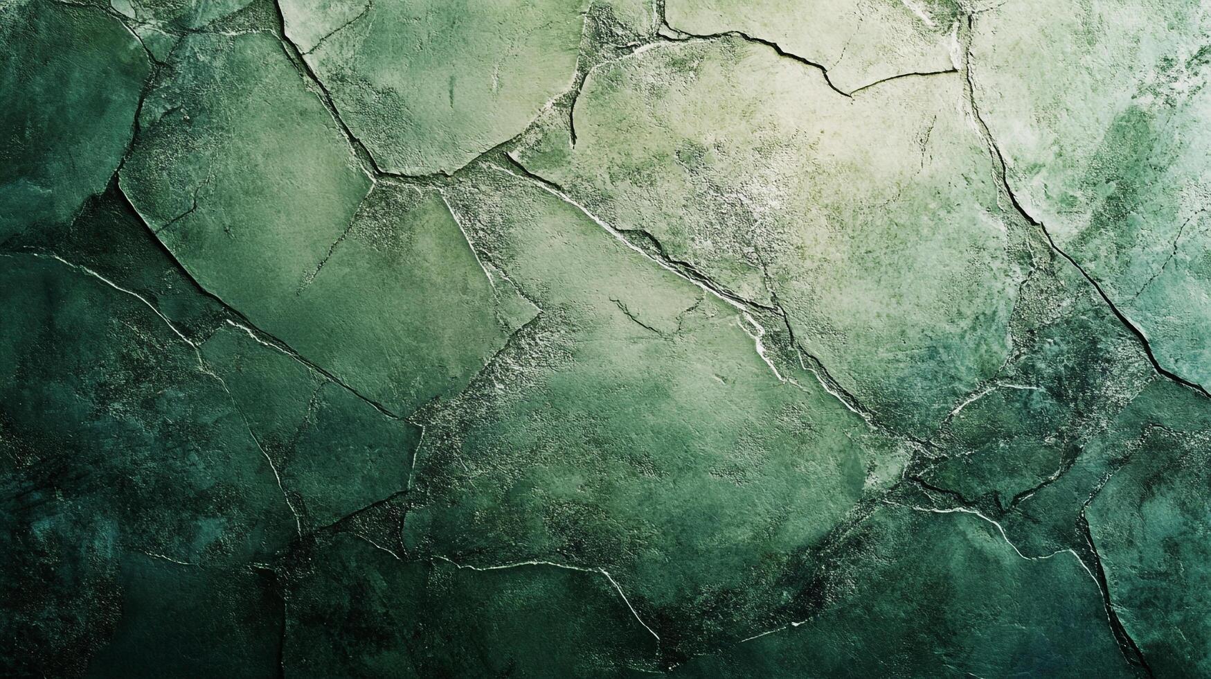 A mesmerizing abstract image of cracked earth with varying shades of green, creating a visually striking and organic texture for any project. photo