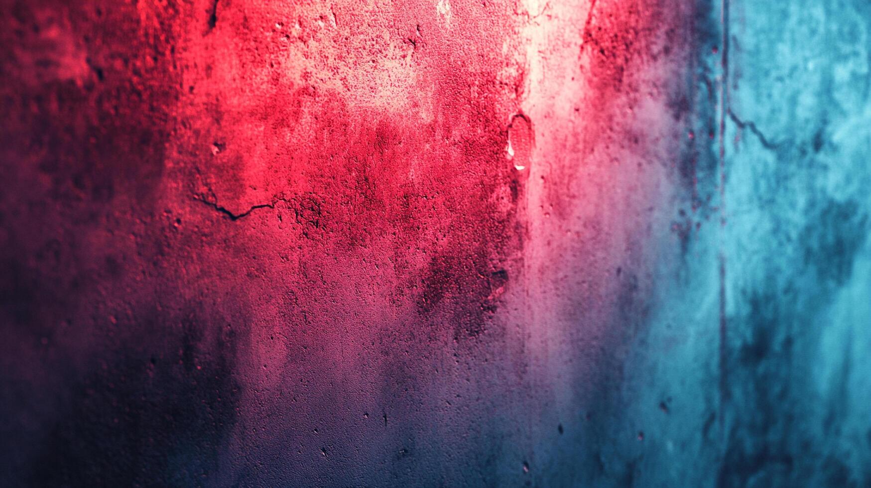 Textured concrete wall split between two light sources. One is red, while the other is blue. Cracks and imperfections cover the surface. photo