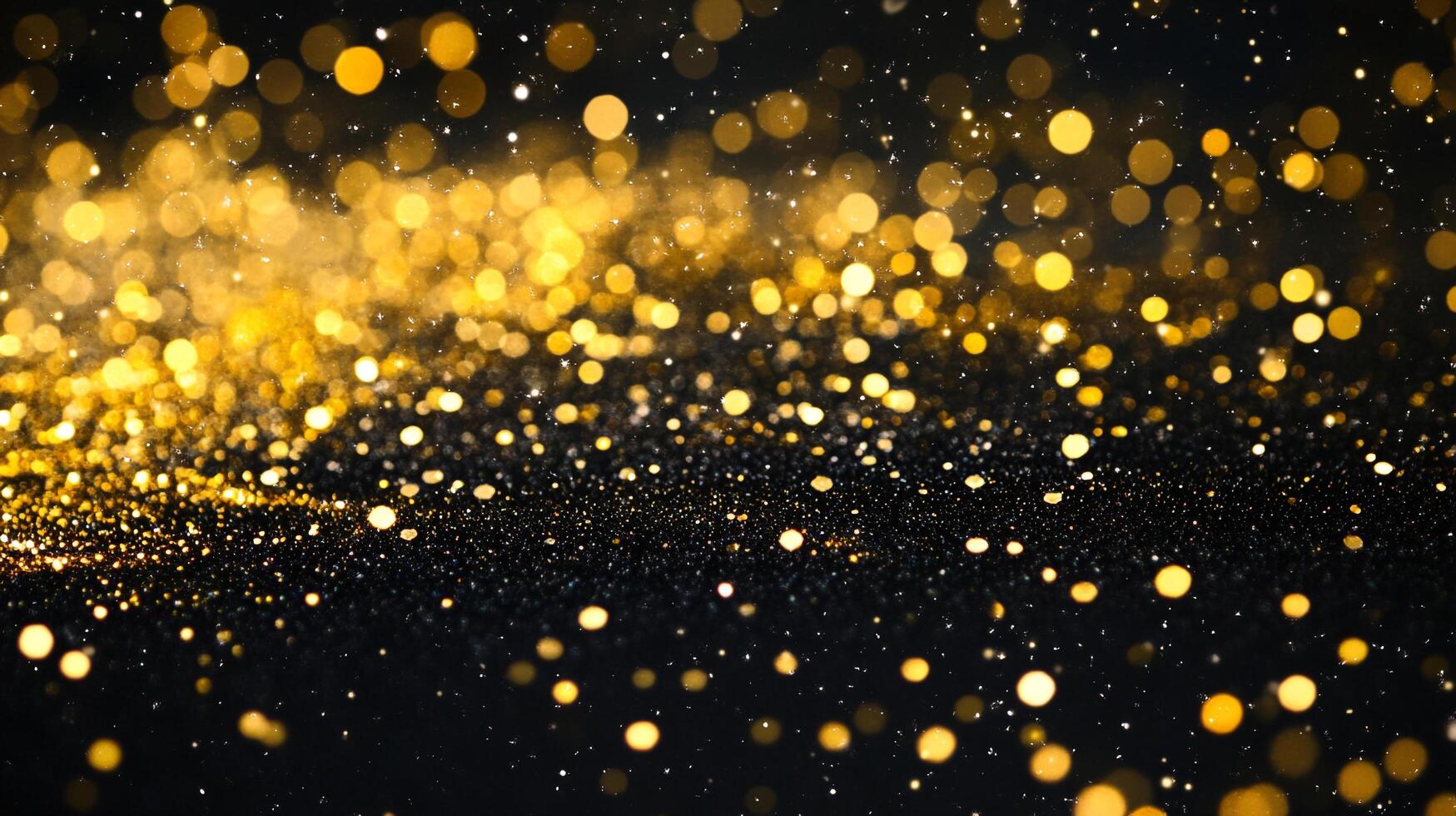 Black background with gold glitter. The glitter is scattered all over the background. The glitter is golden and shiny photo