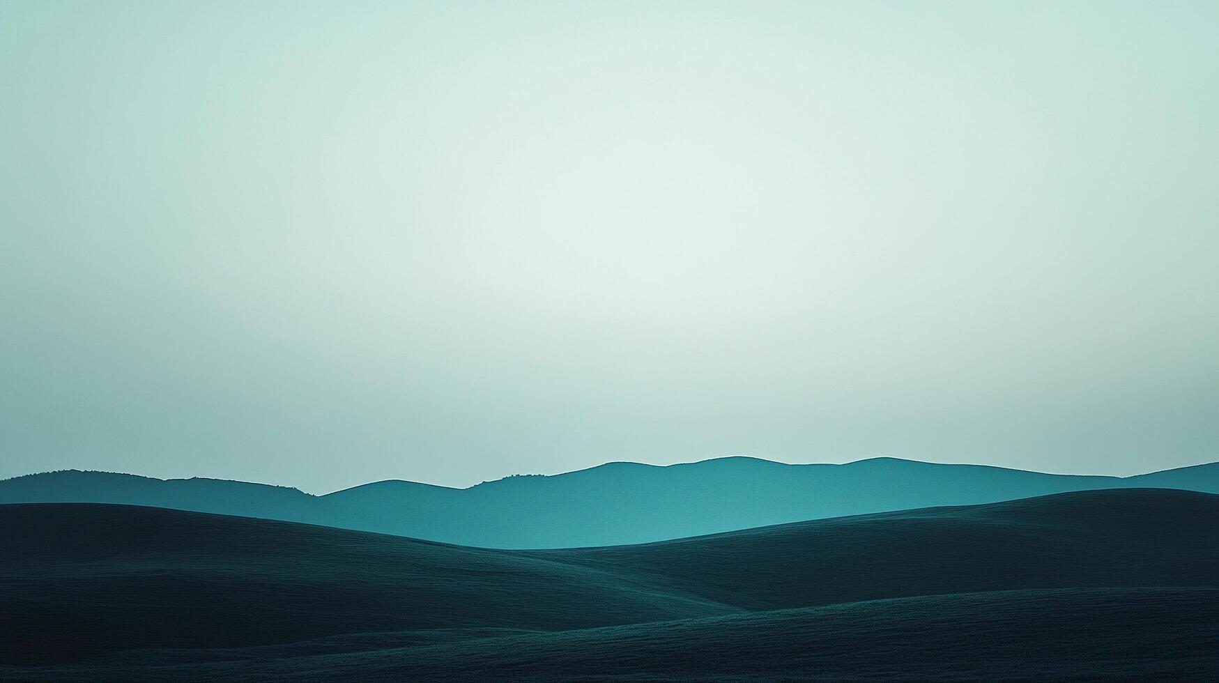 Teal tinted mountain range landscape view with subtle hues of teal color grading and peaceful scenery in a nature shot. photo