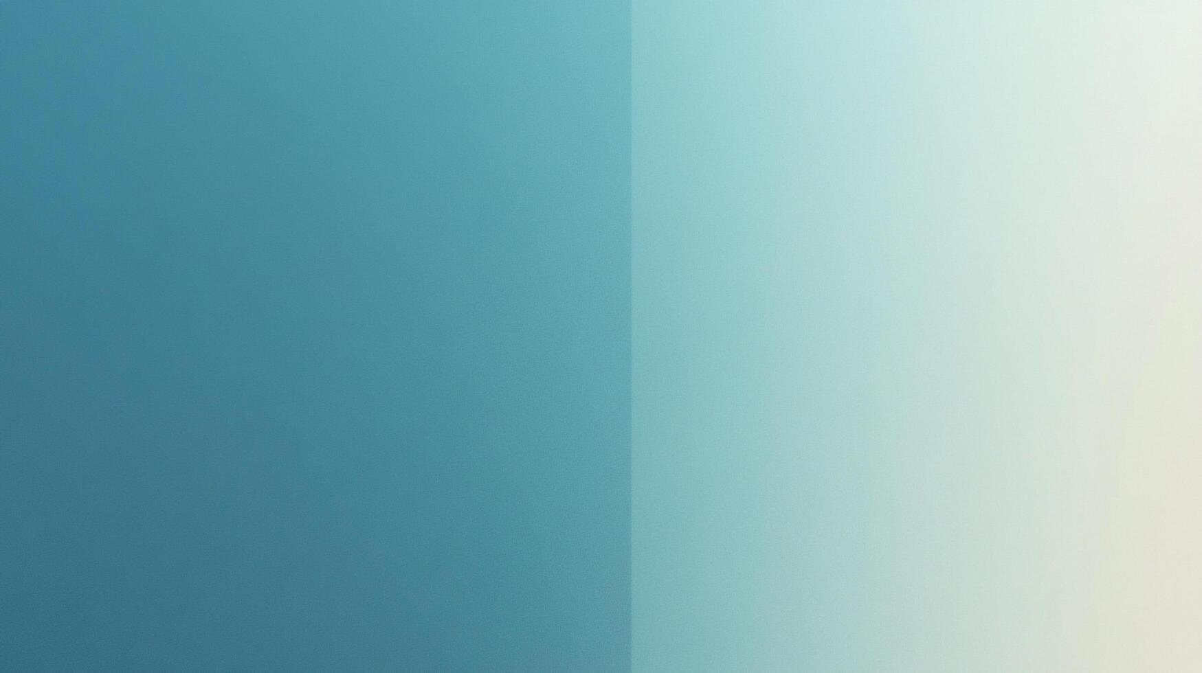A captivating, minimalistic composition featuring a seamless blend of light and dark teal hues, separated by a crisp, vertical gradient. photo