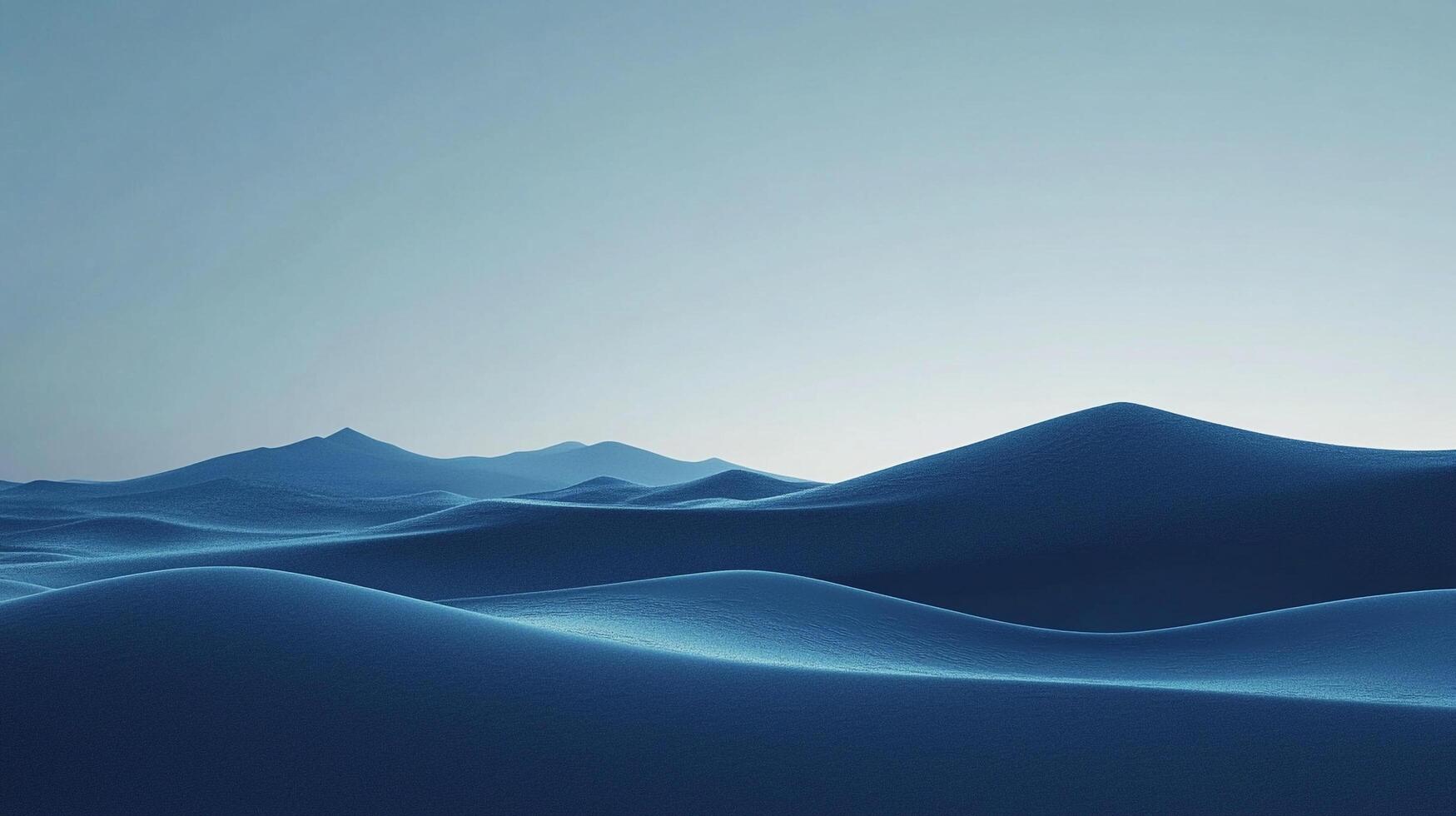 An abstract landscape of rolling, blue hills that evoke a sense of tranquility. The peaks and valleys stretch toward the horizon. photo