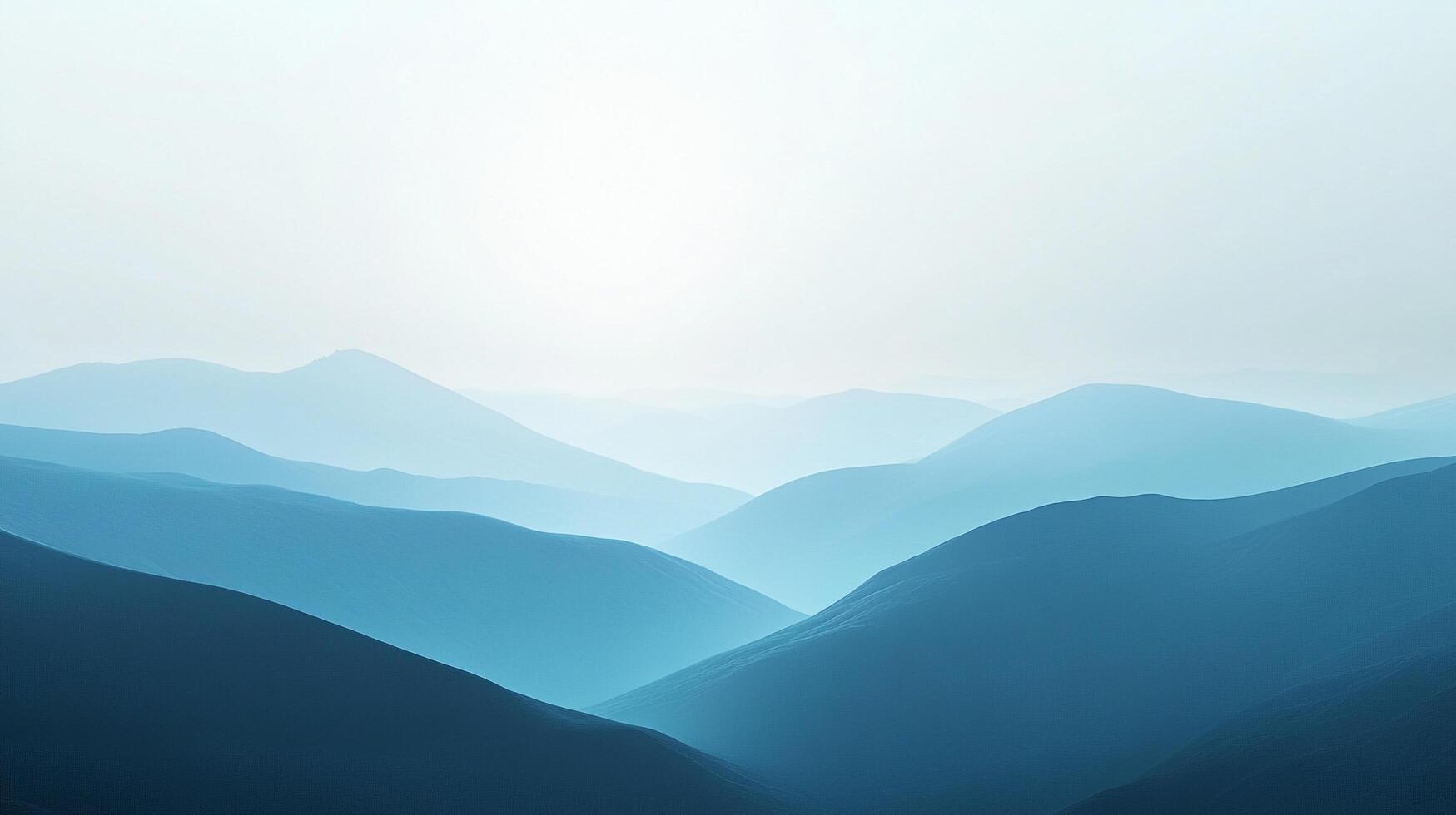 A mesmerizing landscape of blue-toned mountains receding into the misty horizon, evoking a sense of serenity and peaceful isolation. photo