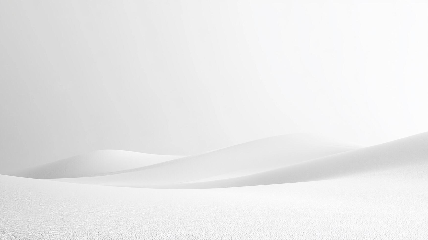 A minimalist landscape of undulating, pristine white dunes evokes feelings of tranquility and serenity in a monochromatic setting. photo