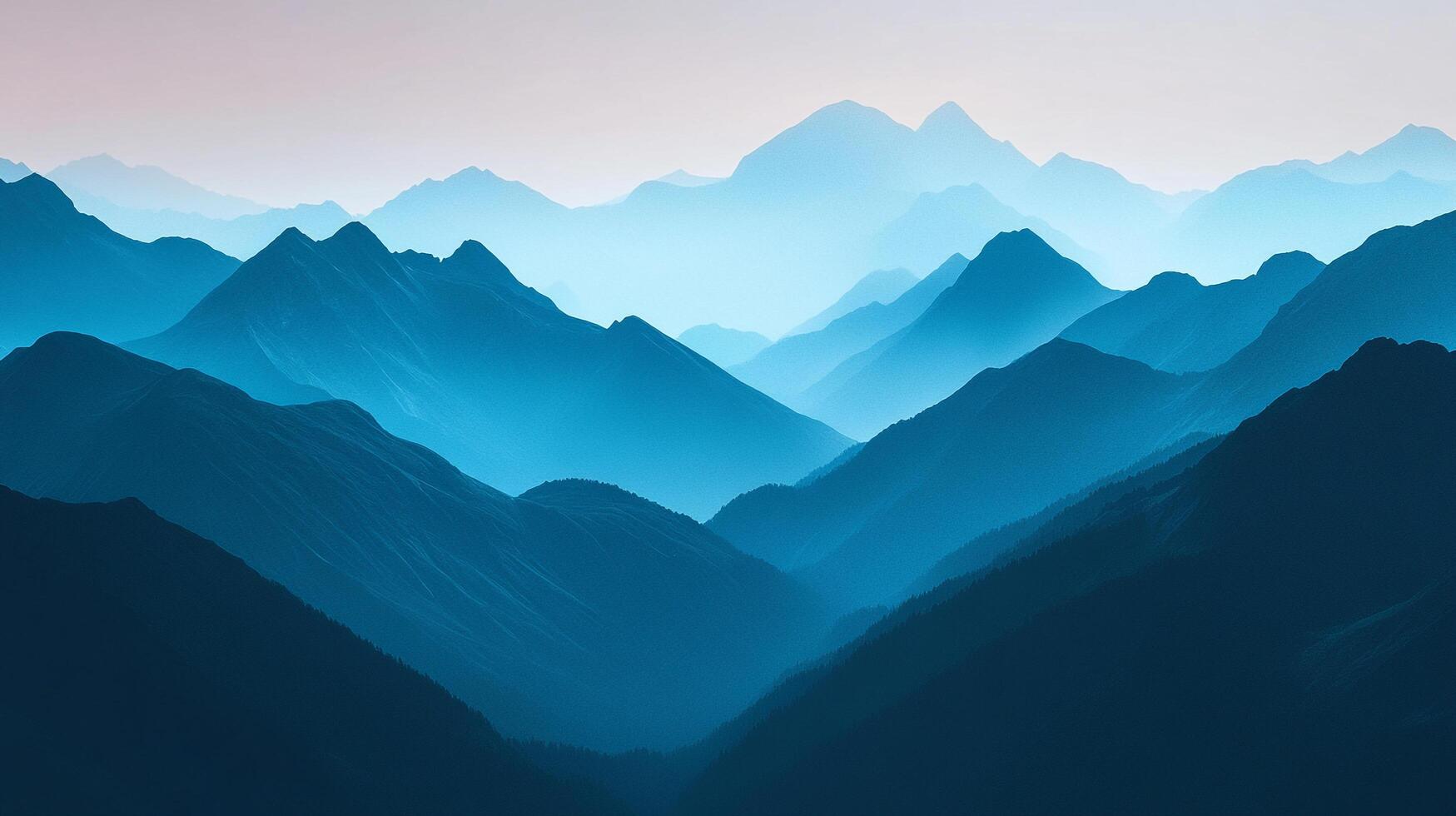 Layers of misty blue mountains create a serene landscape. Light filters through, emphasizing the depth and distance of the mountain range. photo