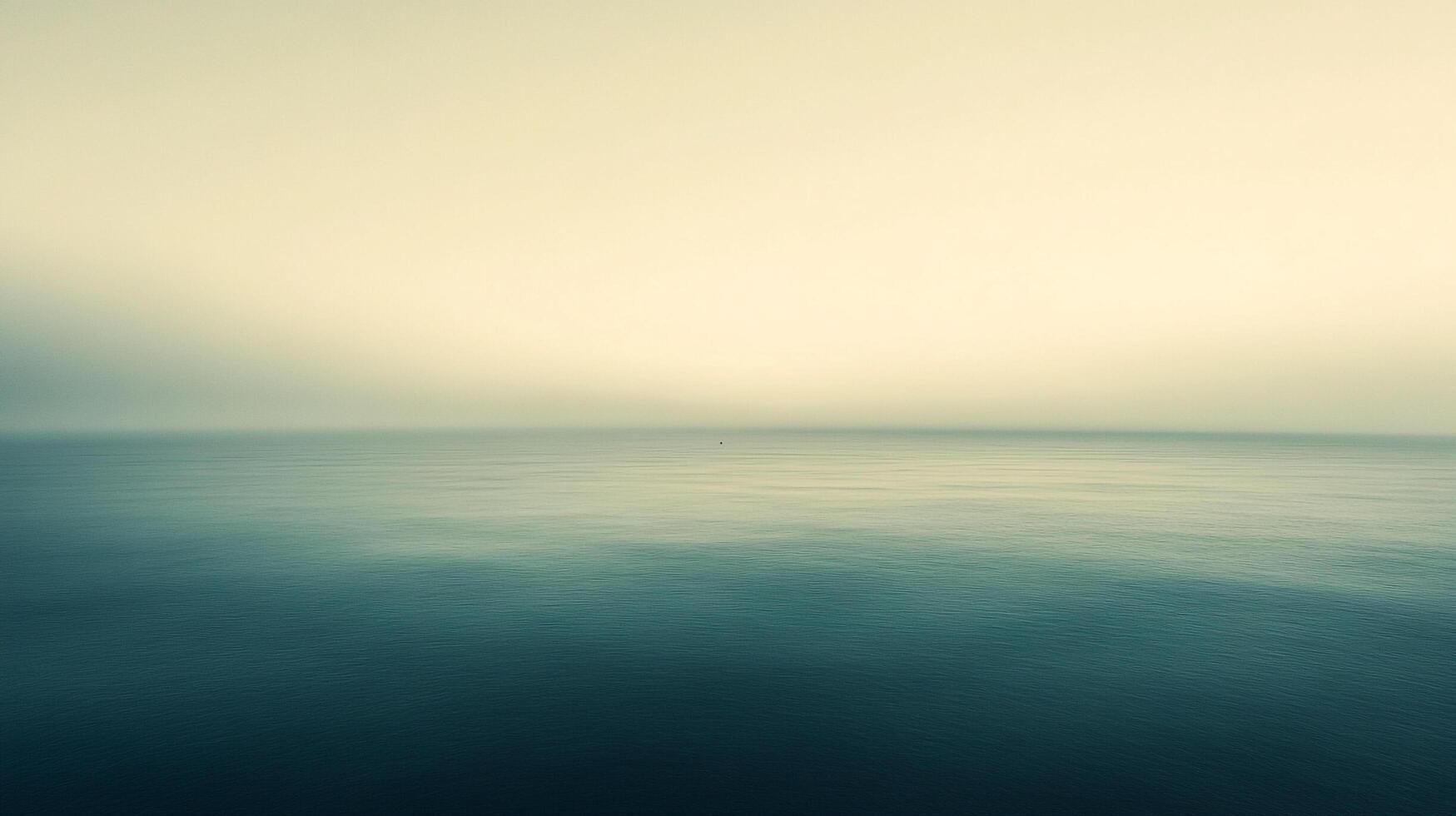 Expansive seascape with a serene blue ocean under a soft, diffused sky evoking tranquility and reflection. Calmness, horizon. photo