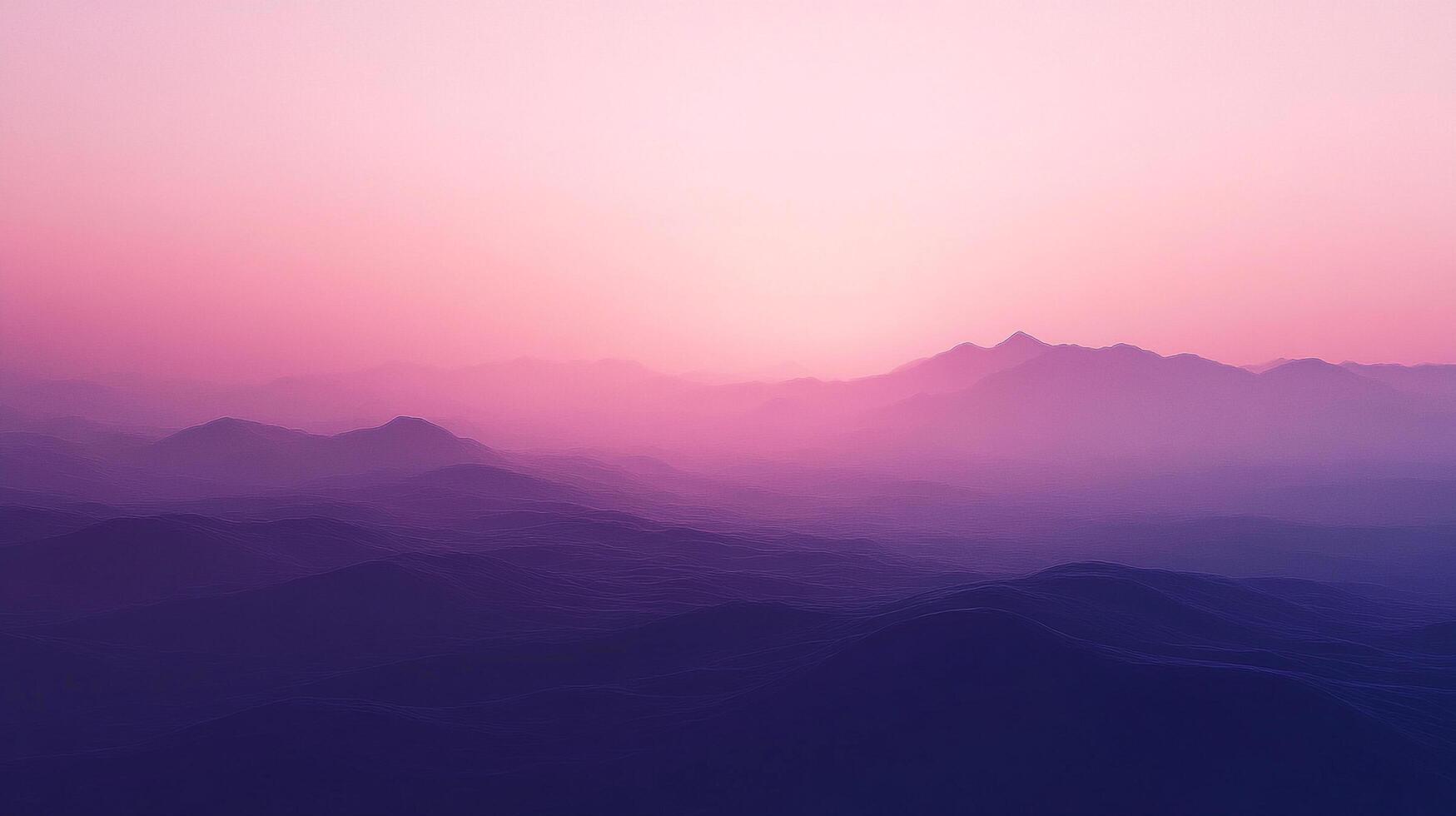 A gorgeous pink and purple gradient sky over soft mountain range silhouettes. The layers blend together in a dreamy, ethereal vista. photo
