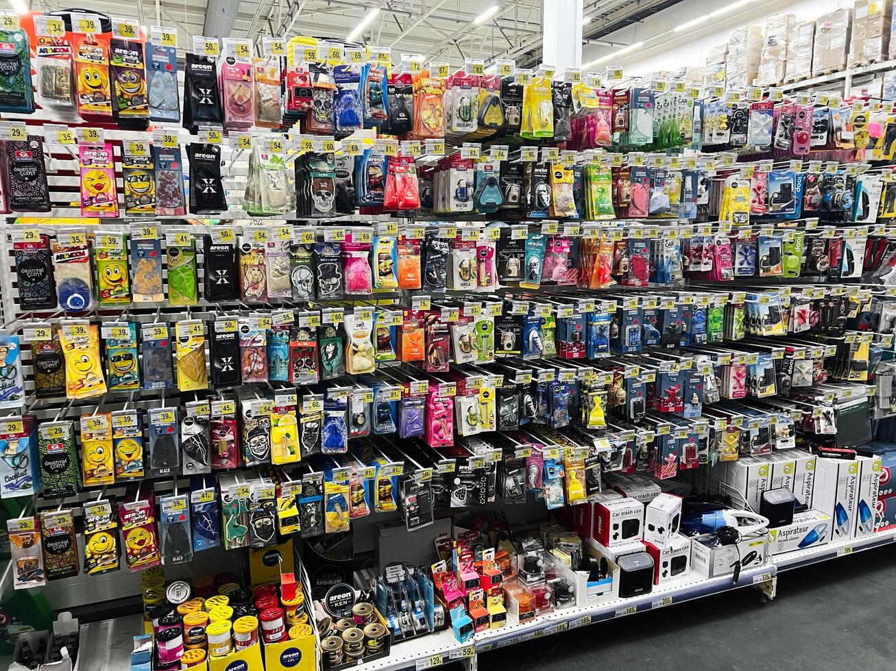 Lviv, Ukraine - February 16, 2025 Wide selection of colorful automotive air fresheners displayed on store shelves photo