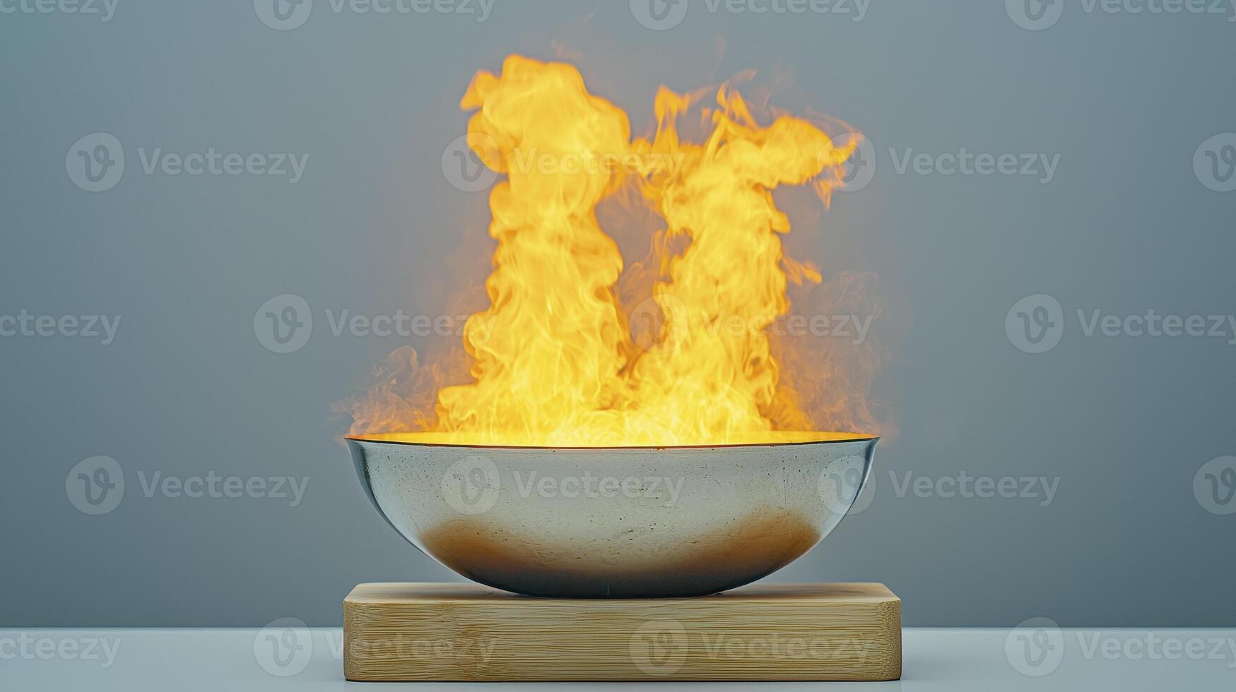 Captivating Fire Display Witness the mesmerizing dance of flames erupting from a sleek silver bowl, a symbol of transformation, energy, and intense heat, all captured in stunning detail The contrast photo
