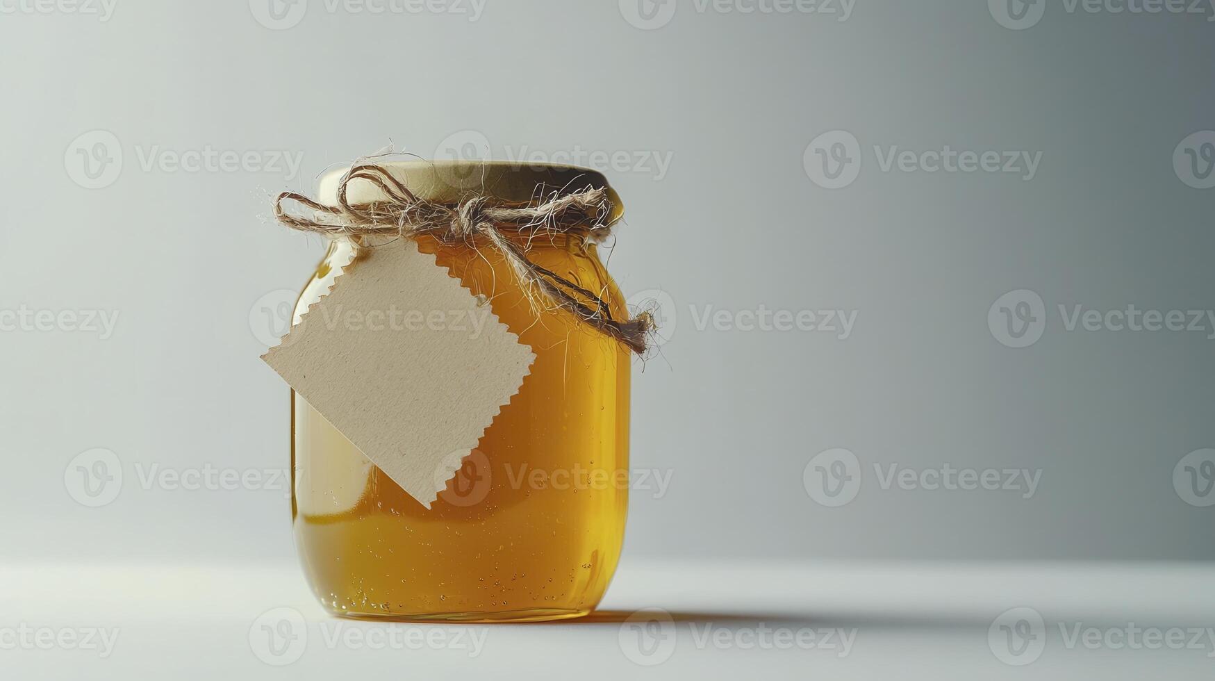 Golden Honey Jar A Delightful Display of Sweetness and Natural Goodness, Capturing the Essence of Pure, Unadulterated Honey, Encased in a Classically Designed Glass Jar, Adorned with a Rustic Twine photo