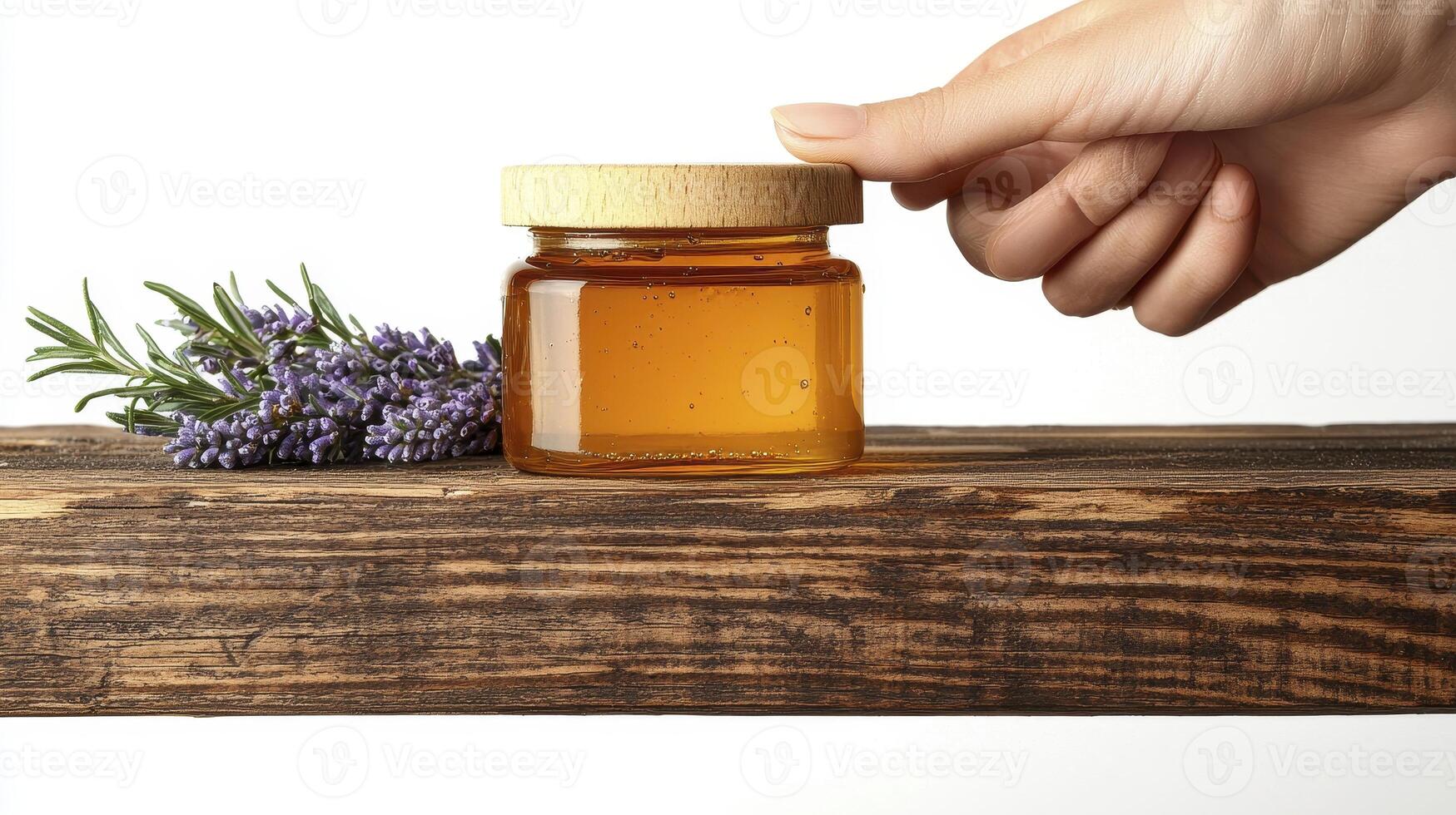 Golden Honey Jar Still Life Capturing the Sweetness of Nature with Lavender Accent A rustic wooden board as a surface for a natural healthy food ingredient that provides energy and healing properties photo