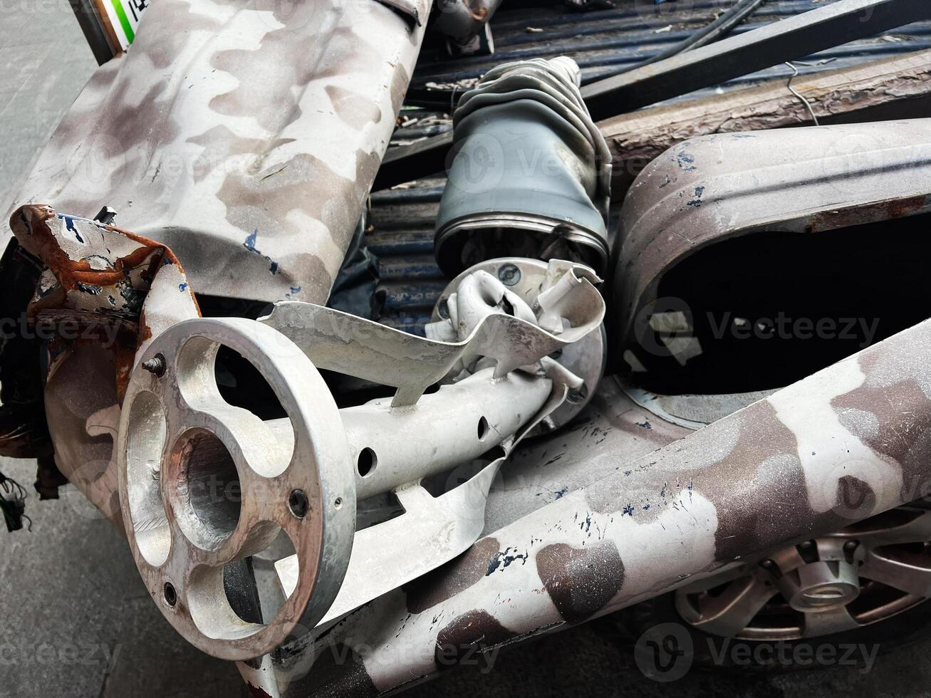 Damaged metal components showcasing mechanical failure after an apparent impact or accident photo