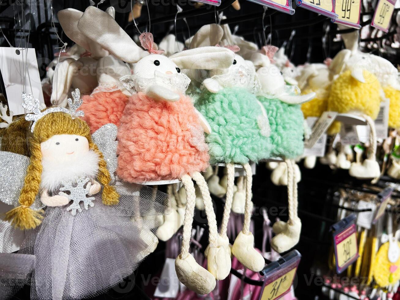 Colorful Decorative Plush Figurines Hanging on Display in a Retail Store photo