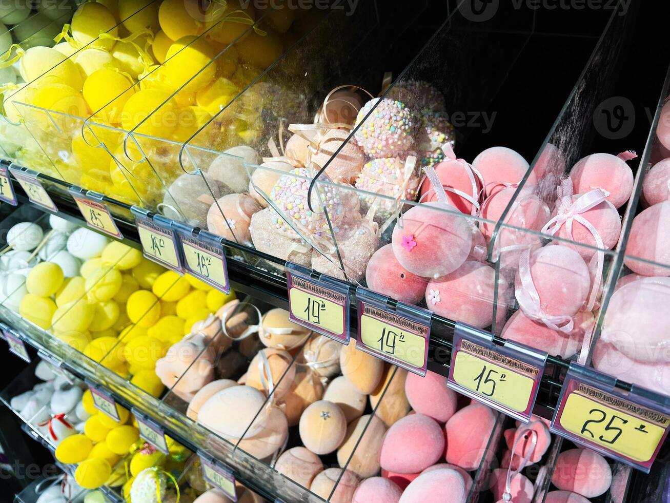 Colorful Bath Bombs Displayed in Transparent Containers on a Store Shelf photo