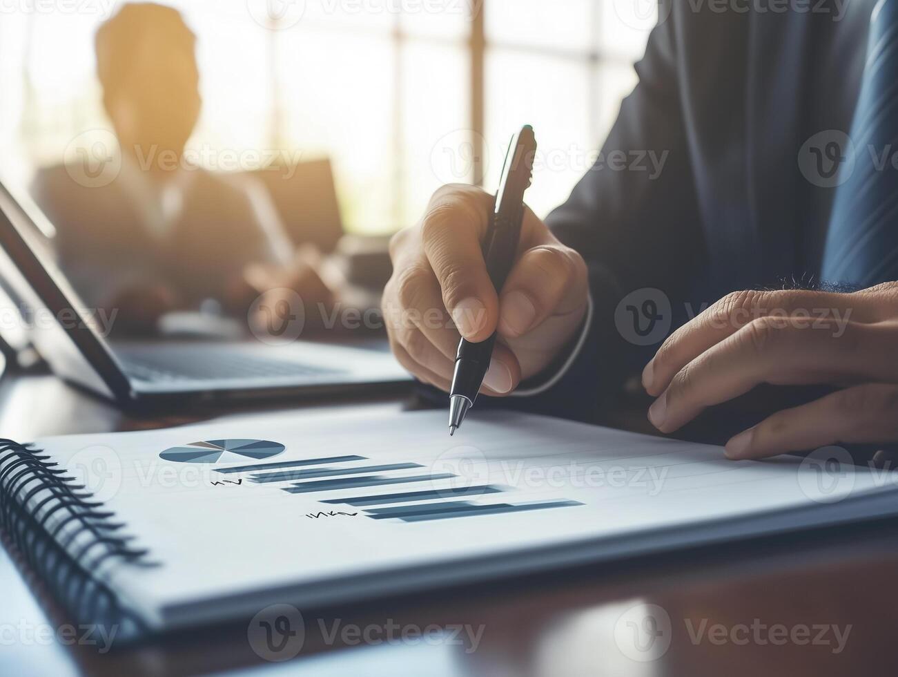Close up of hand writing in notebook with pen, analyzing data trends. atmosphere is professional and focused photo