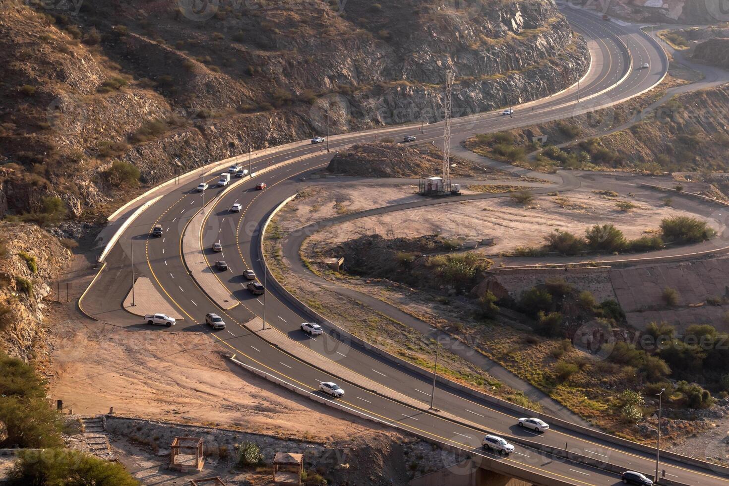 Aerial view of a highway between rocky mountains in Saudi Arabia photo