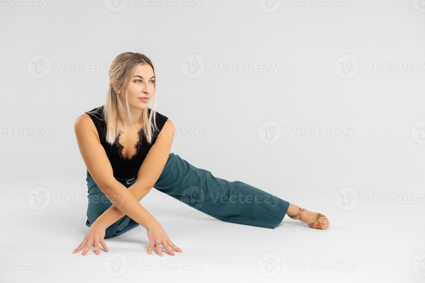 Dancer performing modern dance on white background photo
