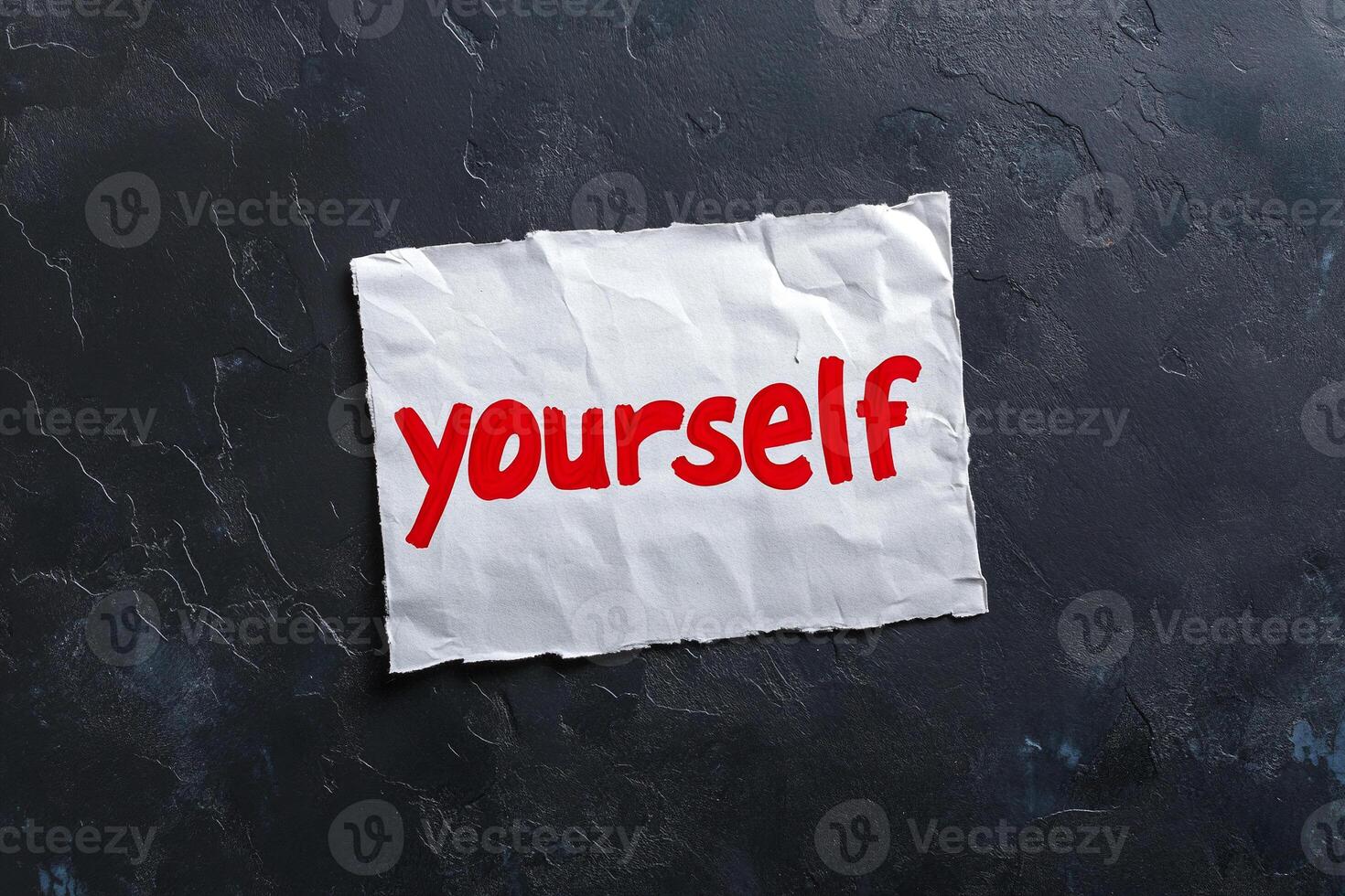 Self-esteem concept on a piece of paper with the word yourself written on it photo