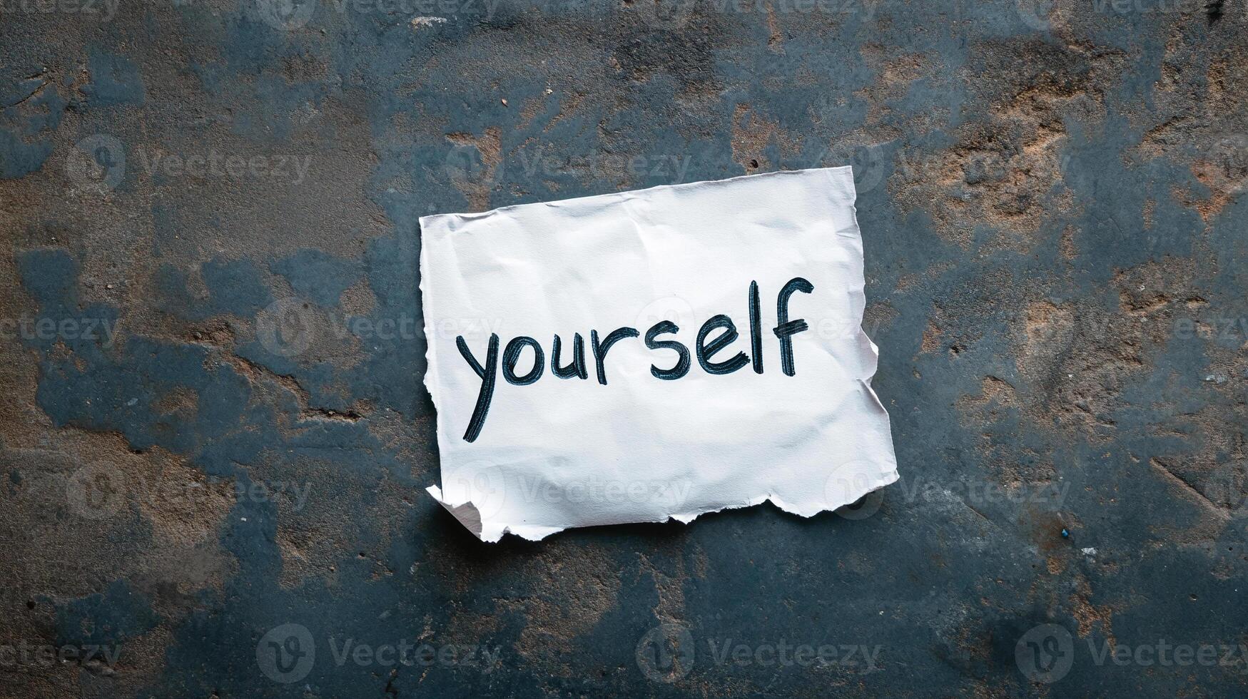 Self-concept concept on a torn paper with the word yourself photo