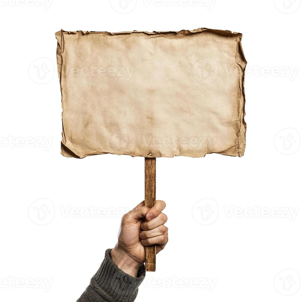 A person holding up a blank paper sign photo