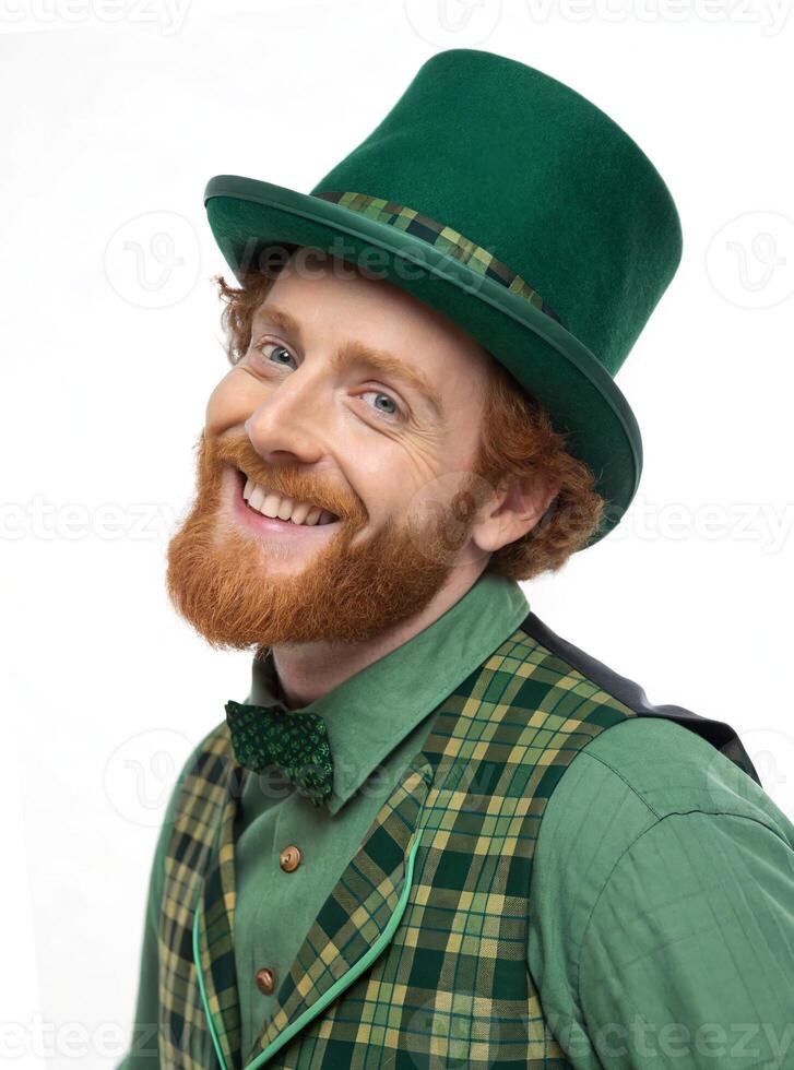 Portrait of a leprechaun wearing green suit and top hat smiling for saint Patrick's day photo