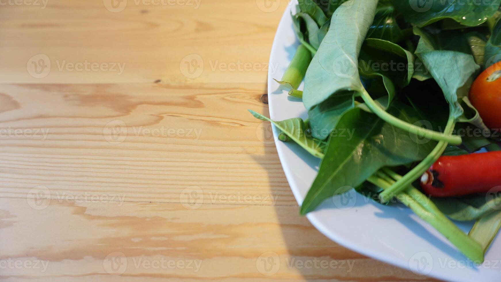 A white plate with vegetables photo