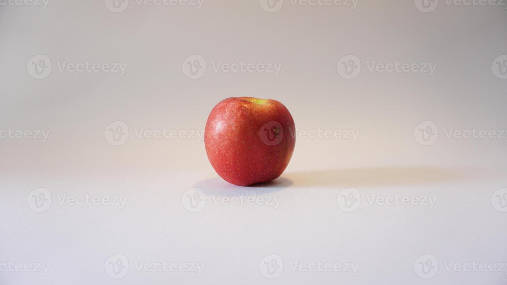 A red apple on a white background photo