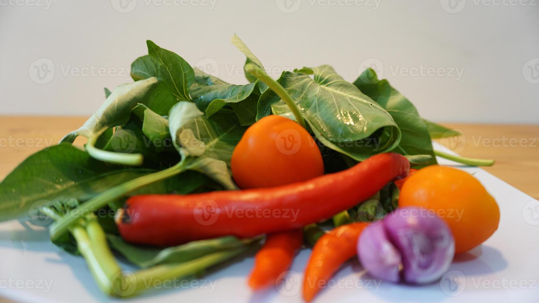A white plate with vegetables photo