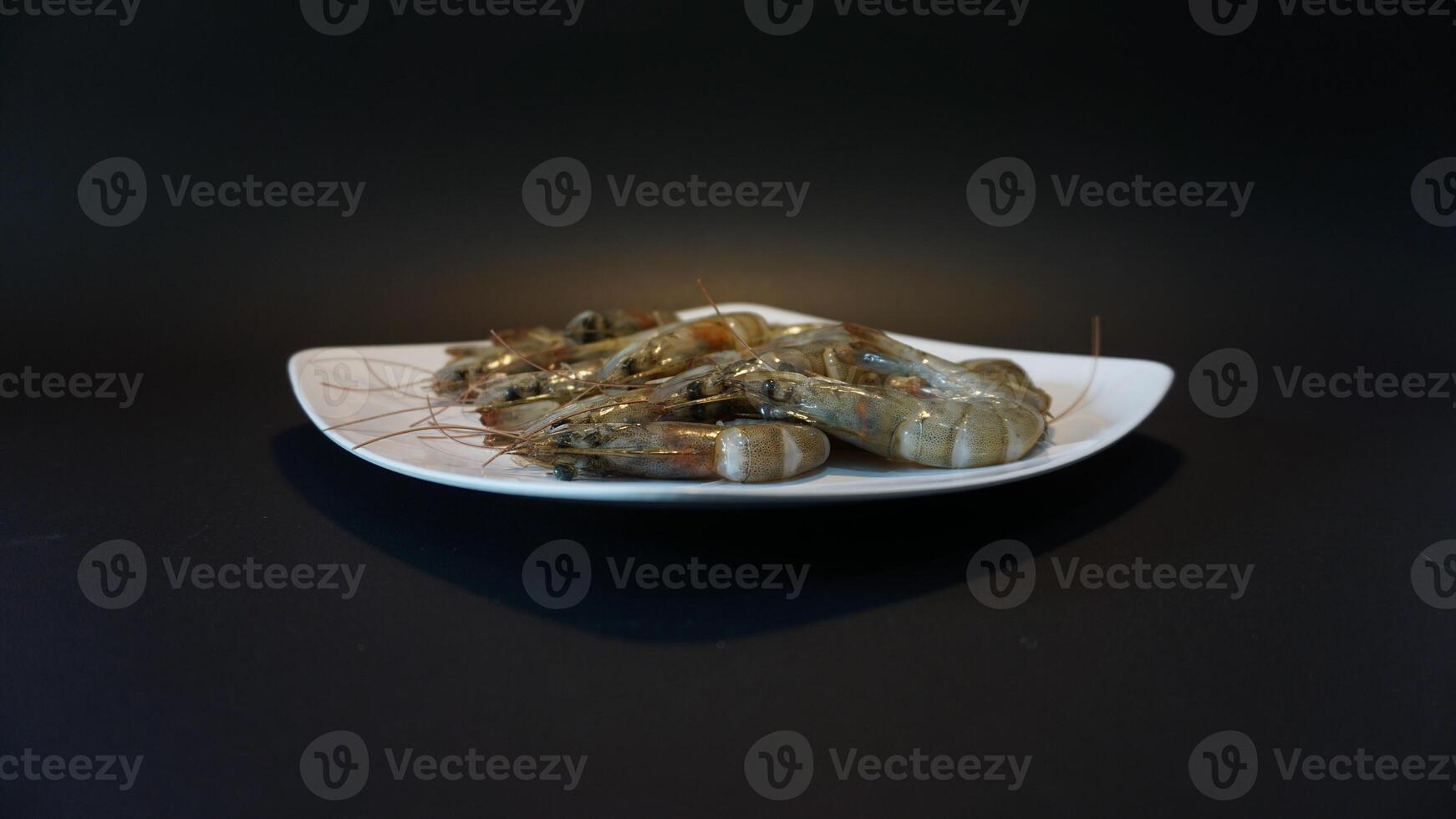 A white plate with shrimp on it photo
