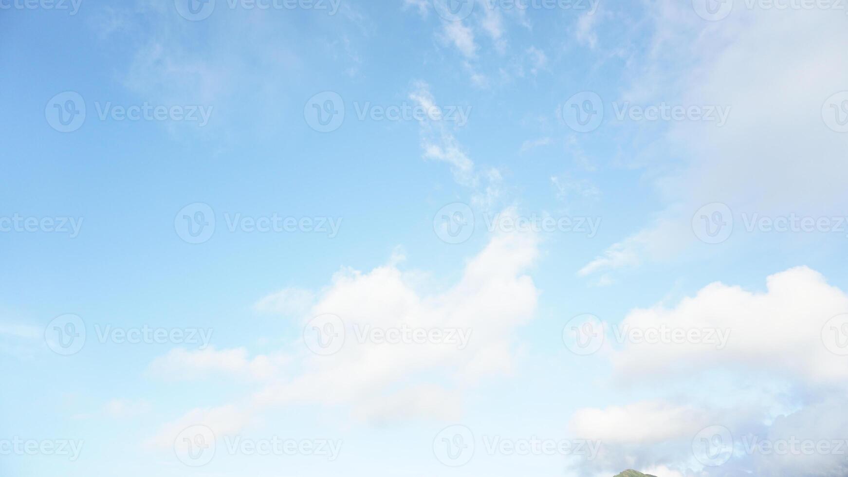 A man flying a kite on a sunny day photo