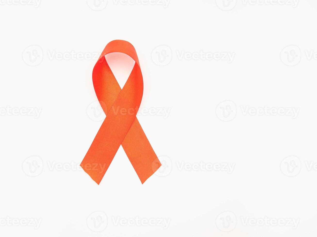 Red ribbon symbol the fight against HIV, AIDS, and cancer on a white background photo