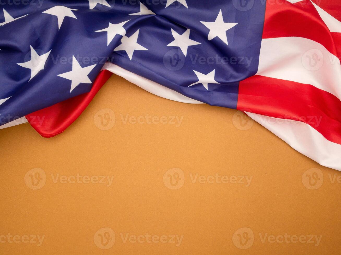 Top view of the American flag on a light brown background photo