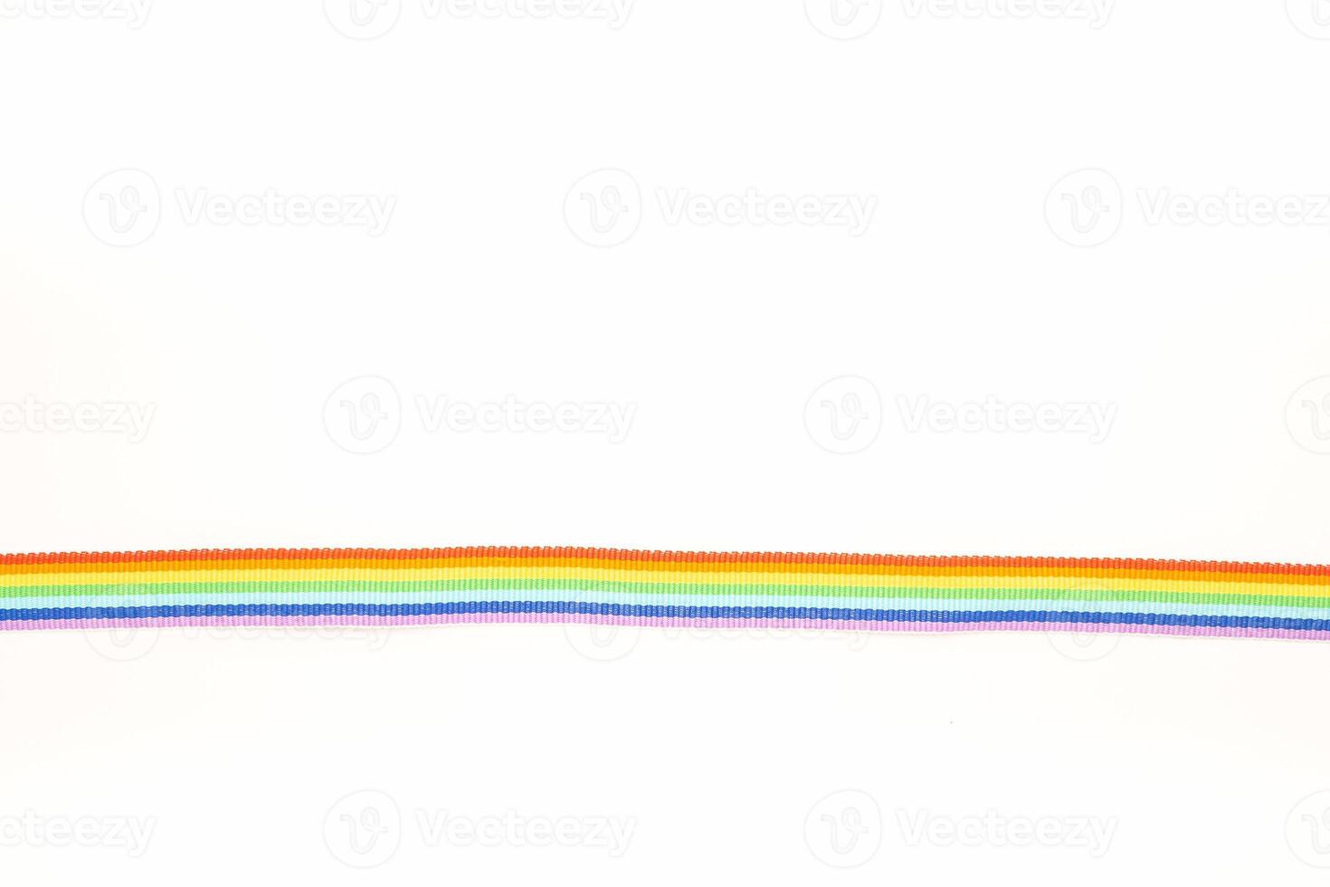 Close-up of rainbow cloth ribbon on a white background. Top view. photo