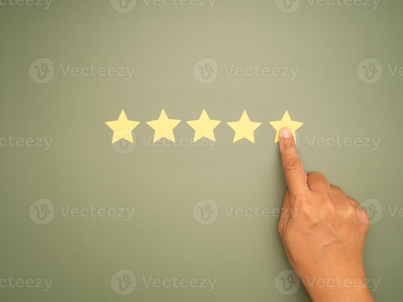 Rating for Satisfaction present by hand of client pressing Five Star photo