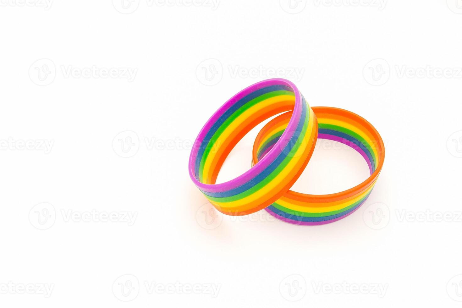 Rainbow patterned wristbands are on a white background. Close-up. photo