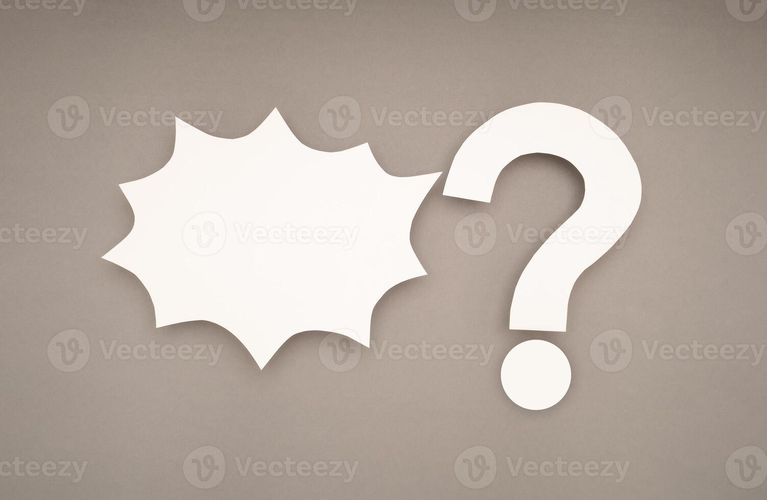 White comic speech bubble and a white question mark on a gray background photo