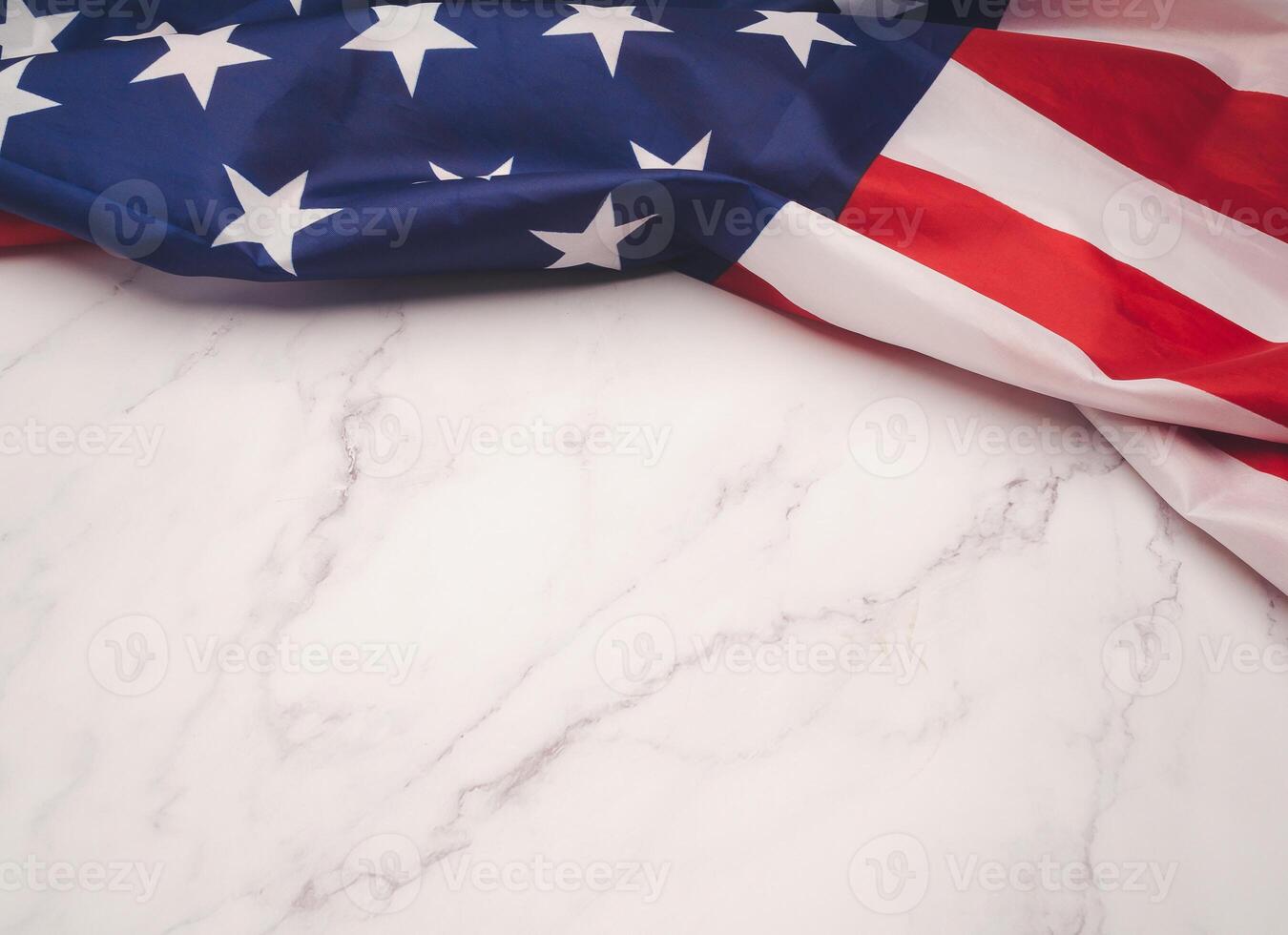 Top view of the American flag on a marble table. photo
